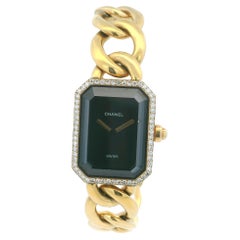 Chanel Paris Reloj de señora con bisel de oro amarillo de 18 quilates y diamantes y esfera de ónice