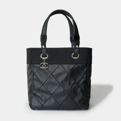Chanel Paris-Biarritz Tote bag in black coated canvas , SHW