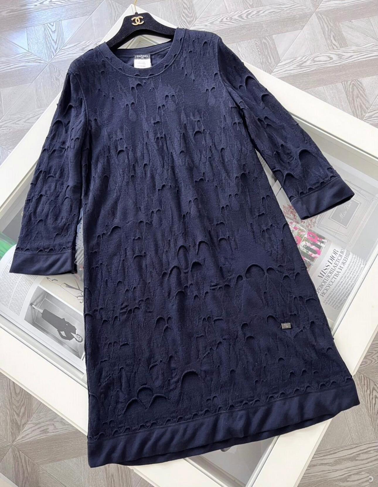 Chanel navy knit dress featuring distressed style ~ from Paris / BYZANCE Collection, Metiers d'Art by Karl Lagerfeld
- CC logo mosaic charm at waist 
Size mark 40 FR / Condition: pristine