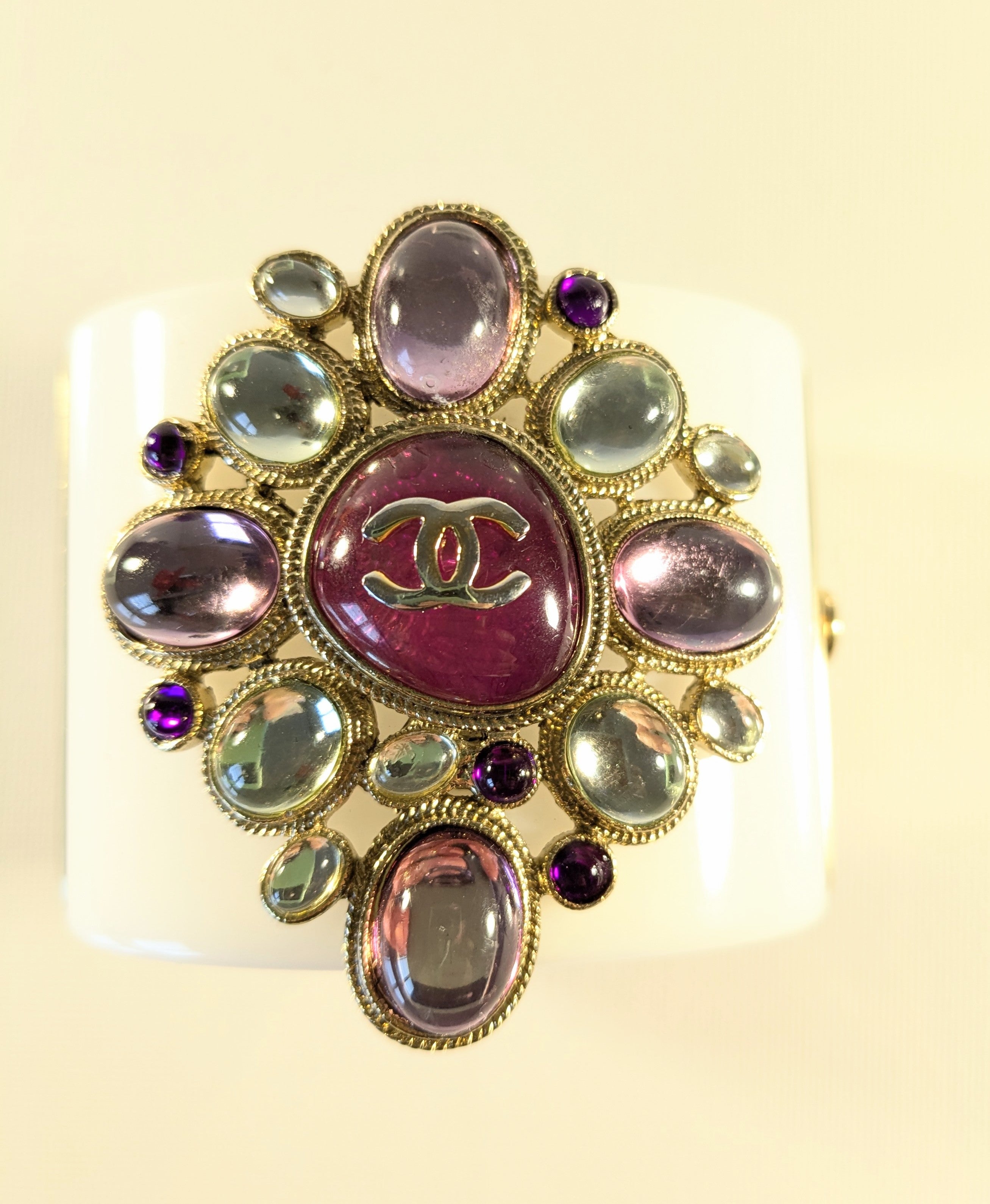 Rare Chanel 11A Paris-Byzance Large Pearl Poured Glass Gripoix cuff  bracelet. This unique piece of costume jewelry  is made of white acetate and is embellished with a metal and enamel medallion and glass beads. Colour combination is sublime (pink