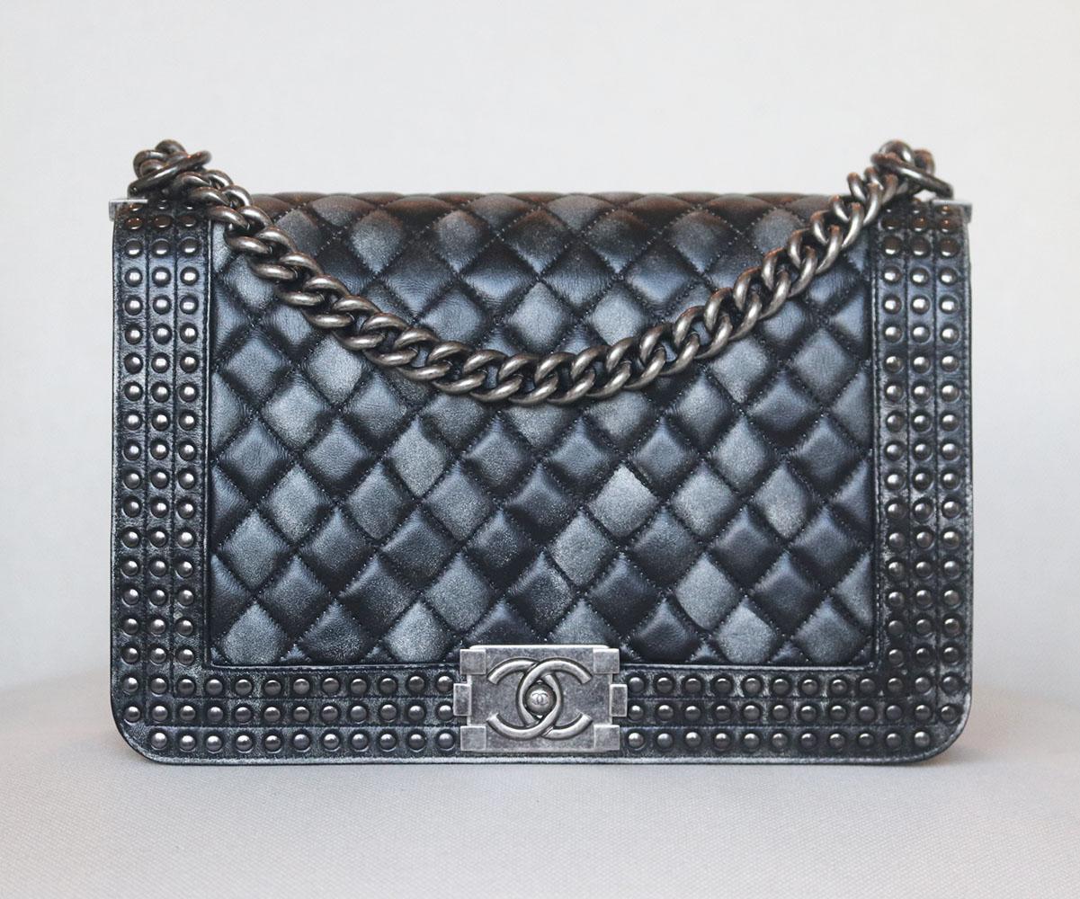 Chanel Paris-Dallas 2014 Faded Studded Calfskin Large Boy Flap Bag has been hand-finished by skilled artisans in the label's workshop, it is boasting a faded calfskin and studded exterior, this design is accented with gunmetal-toned and black