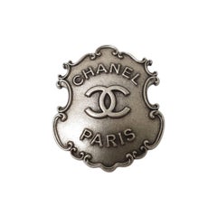 Spilla Chanel Paris-Dallas in argento