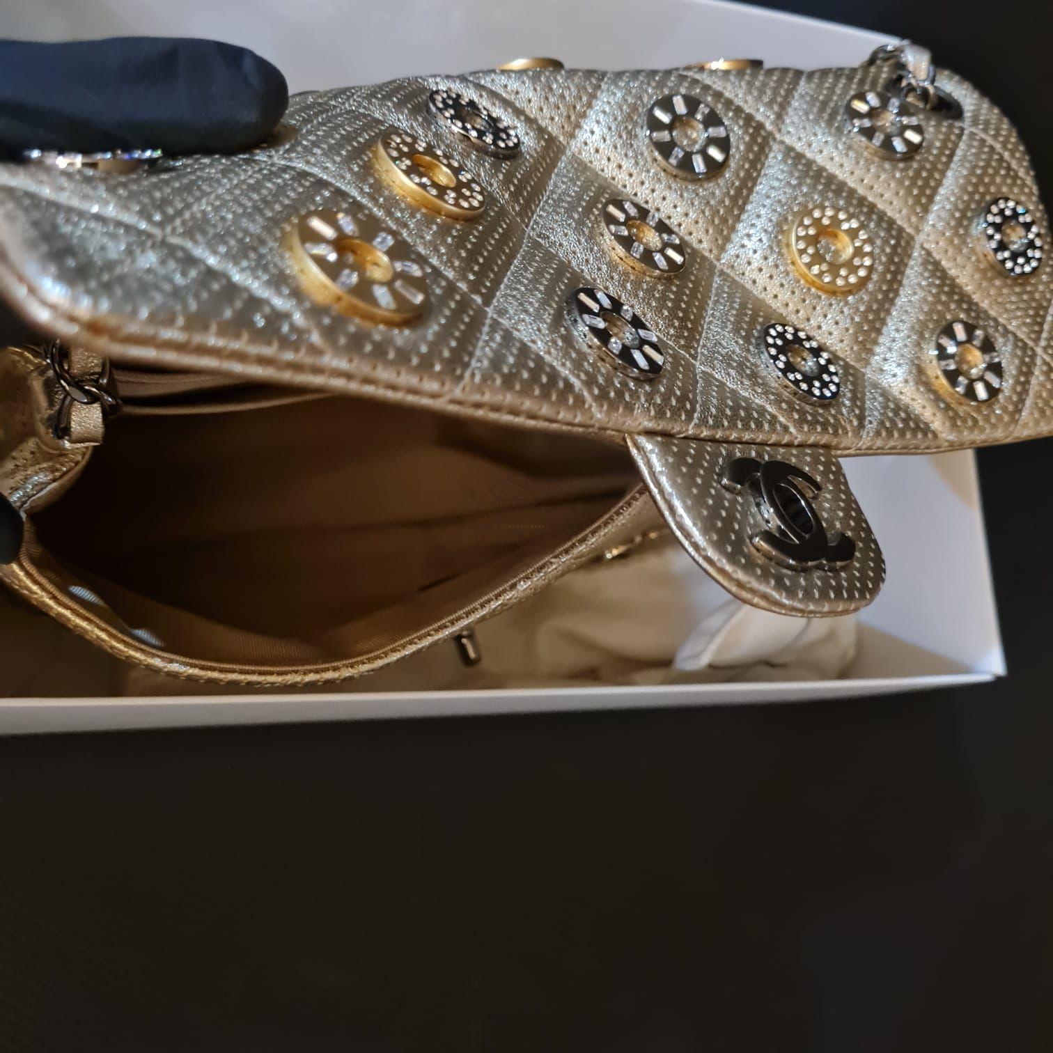 Rare classic coin embellished gold perforated bag from the Dubai collection. In amazing condition. A show-stopper bag for sure. Item series #20. Comes  with authenticity card, dust bag and box. 