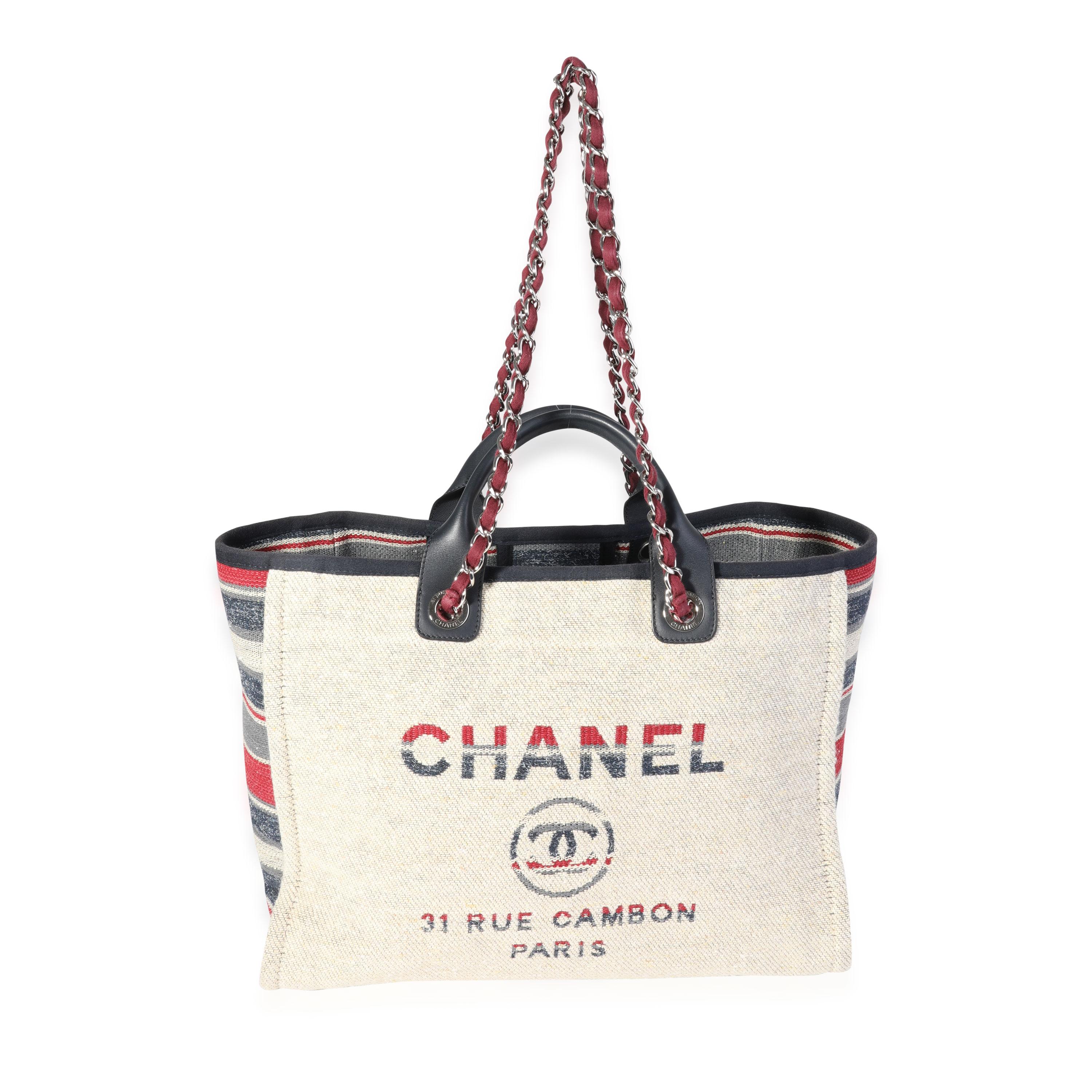 Listing Title: Chanel Paris-Hamburg Multicolor Striped Wool large Deauville Tote
SKU: 120668
Condition: Pre-owned 
Handbag Condition: Very Good
Condition Comments: Very Good Condition. Light scratching to hardware. Light marks throughout