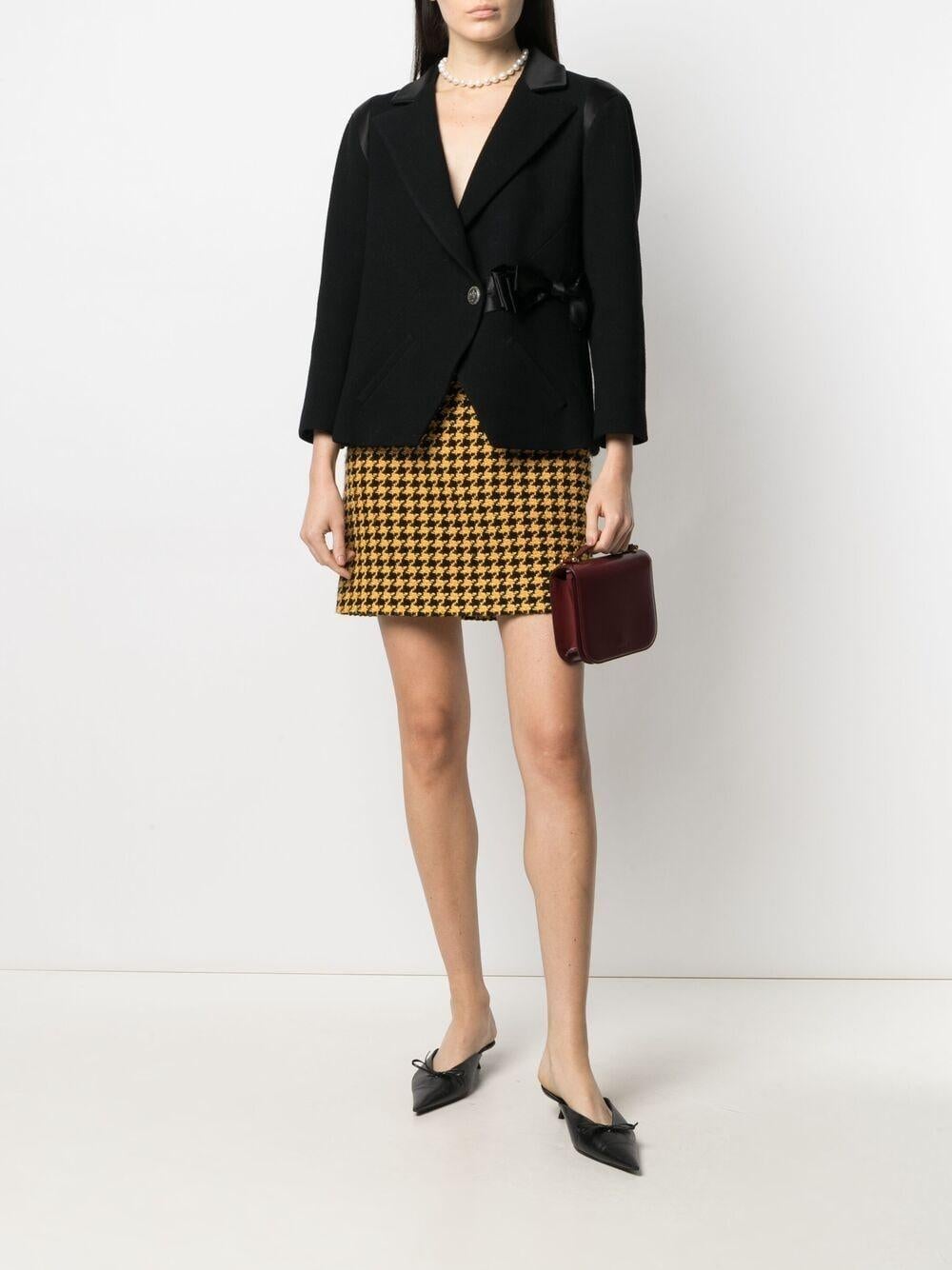 Chanel black tweed jacket with brand's signature Bow from Paris / LONDON Collection, Metiers d'Art by Maestro Karl Lagerfeld.
Boutique price over 8,000$
- CC logo 'crown' buttons at center front
- chic satin bow accent at waist
- black silk lining,
