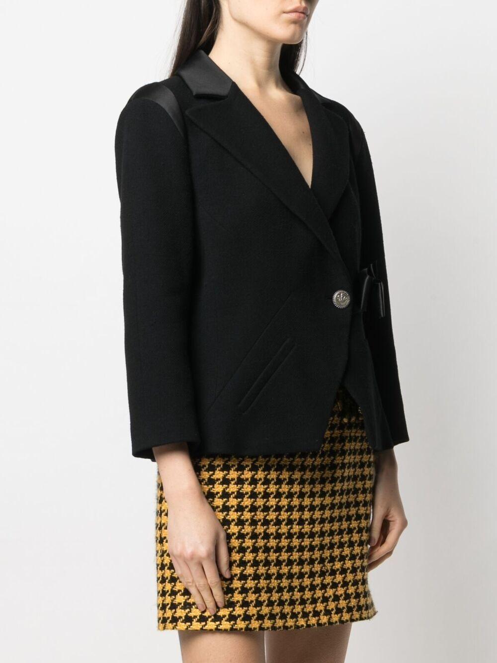 Chanel Paris / London Black Tweed Jacket with Bow In Excellent Condition In Dubai, AE