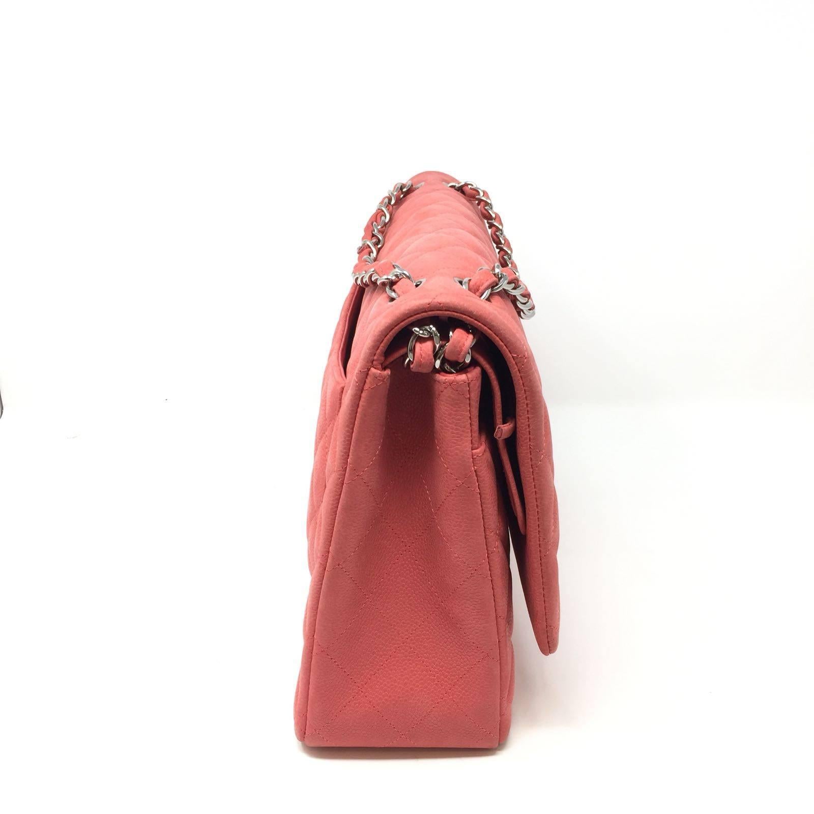 Chanel Maxi Jumbo Bag in Coral Mat Caviar Quilted Soft Leather.
Classic Silver CC Logo Twist Closure Opens Double Flap Style With Woven Chain.
Identification Authenticity Code  : Year 2015 .
Inside the SS Stamp specifies that Buy was purchased at an