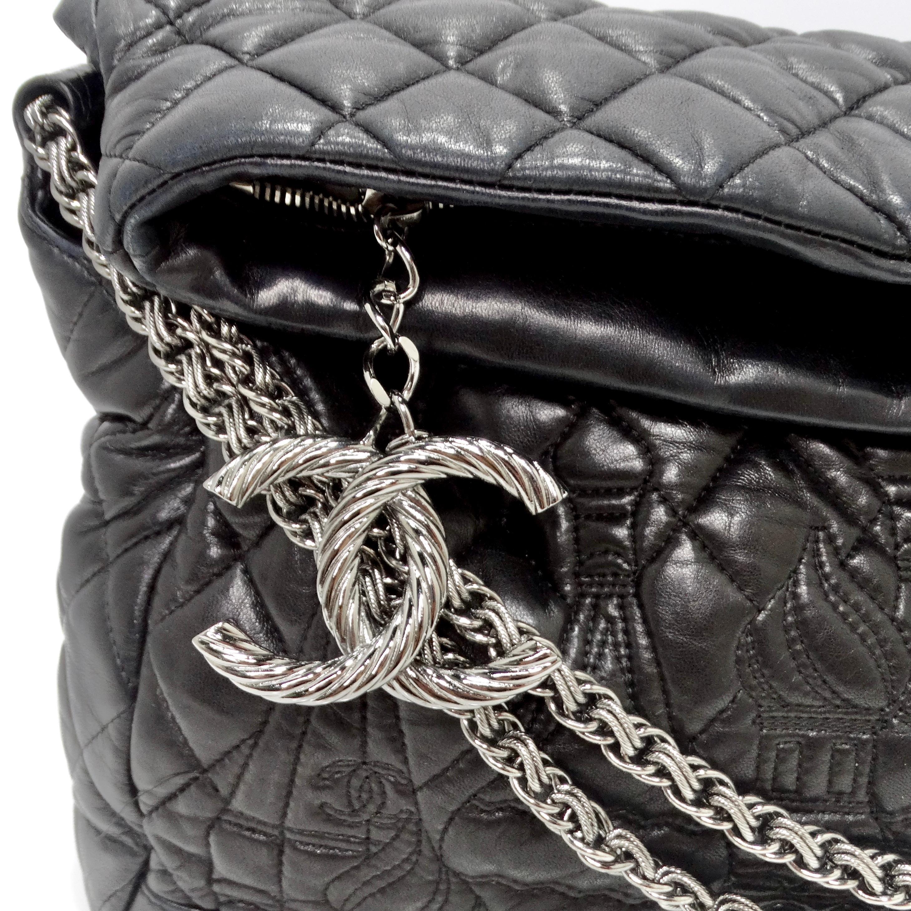 Do not miss out on the Chanel Paris-Moscow Red Square Kremlin Large Shoulder Bag – a captivating piece that seamlessly blends iconic Chanel design with an artisanal twist. The black quilted leather exterior sets the stage for the showstopping