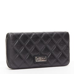 CHANEL Paris New York black quilted leather silver logo long zip wallet