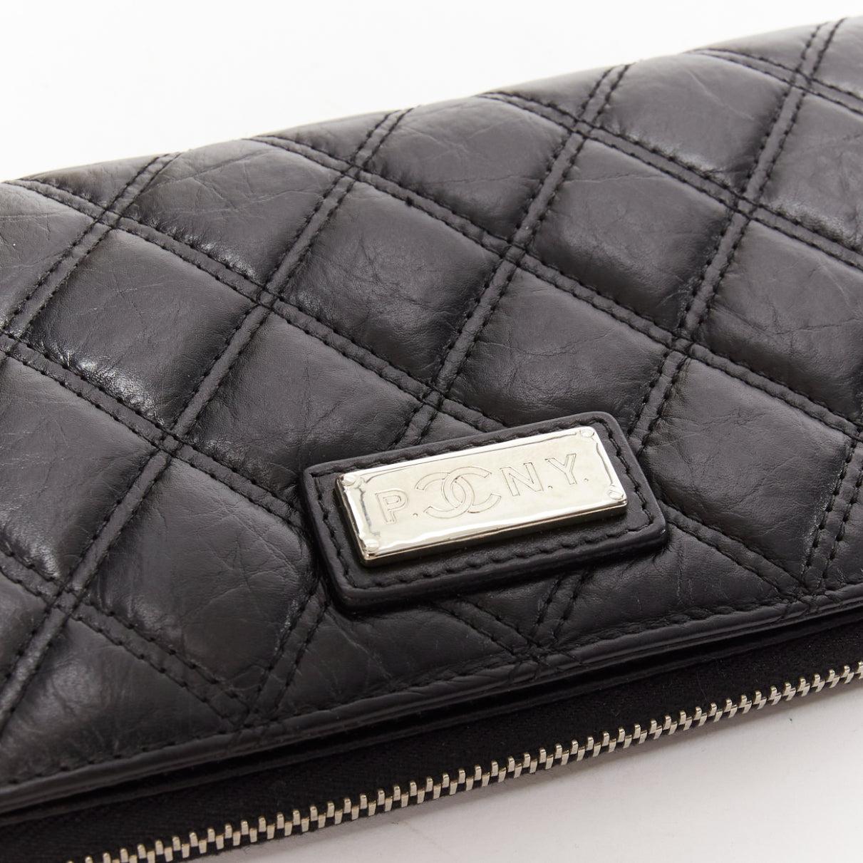 Women's or Men's CHANEL Paris New York black quilted leather silver logo long zip wallet For Sale