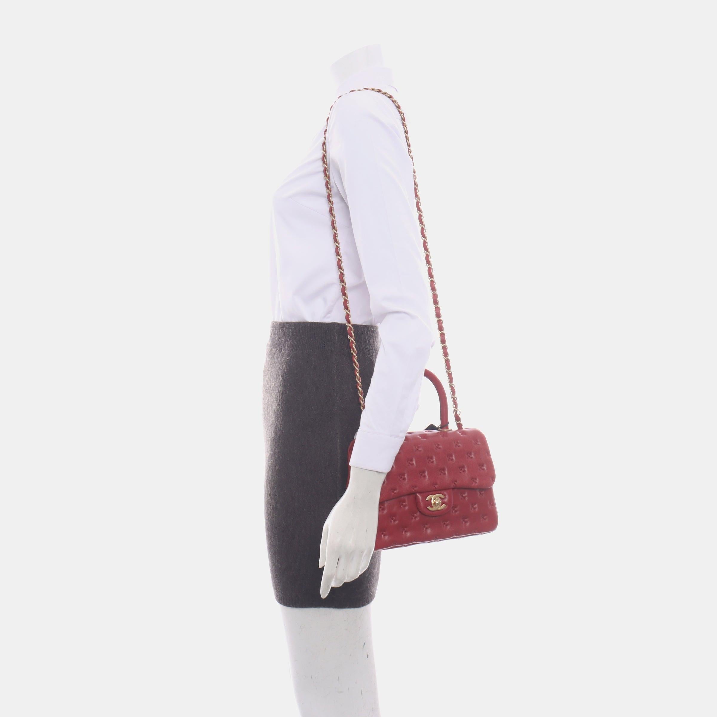 Chanel Paris-Rome Cross Stitch Mini Coco Handle Red Lambskin Crossbody Bag, 2017
 These are professional photos of the actual bag offered by Luxbags.
 Crafted from soft lambskin leather, the CHANEL Paris-Rome Cross Stitch Mini Coco Handle Red