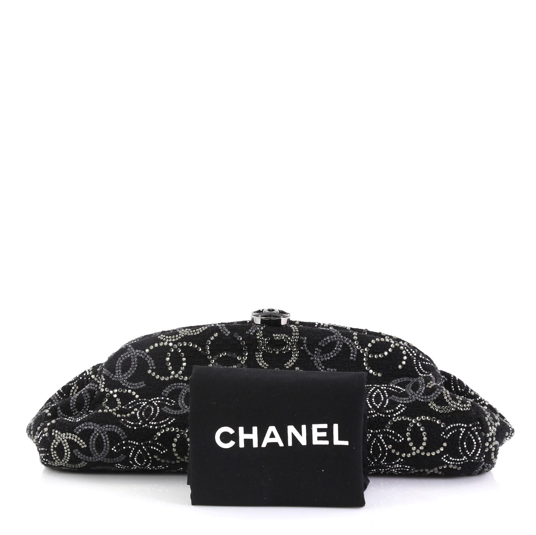 This Chanel Paris-Shanghai Frame Clutch Crystal Embellished Boucle Tweed, crafted from black crystal embellished tweed, features framed silhouette and gunmetal-tone hardware. It opens to a black satin interior with zip pocket. Hologram, sticker