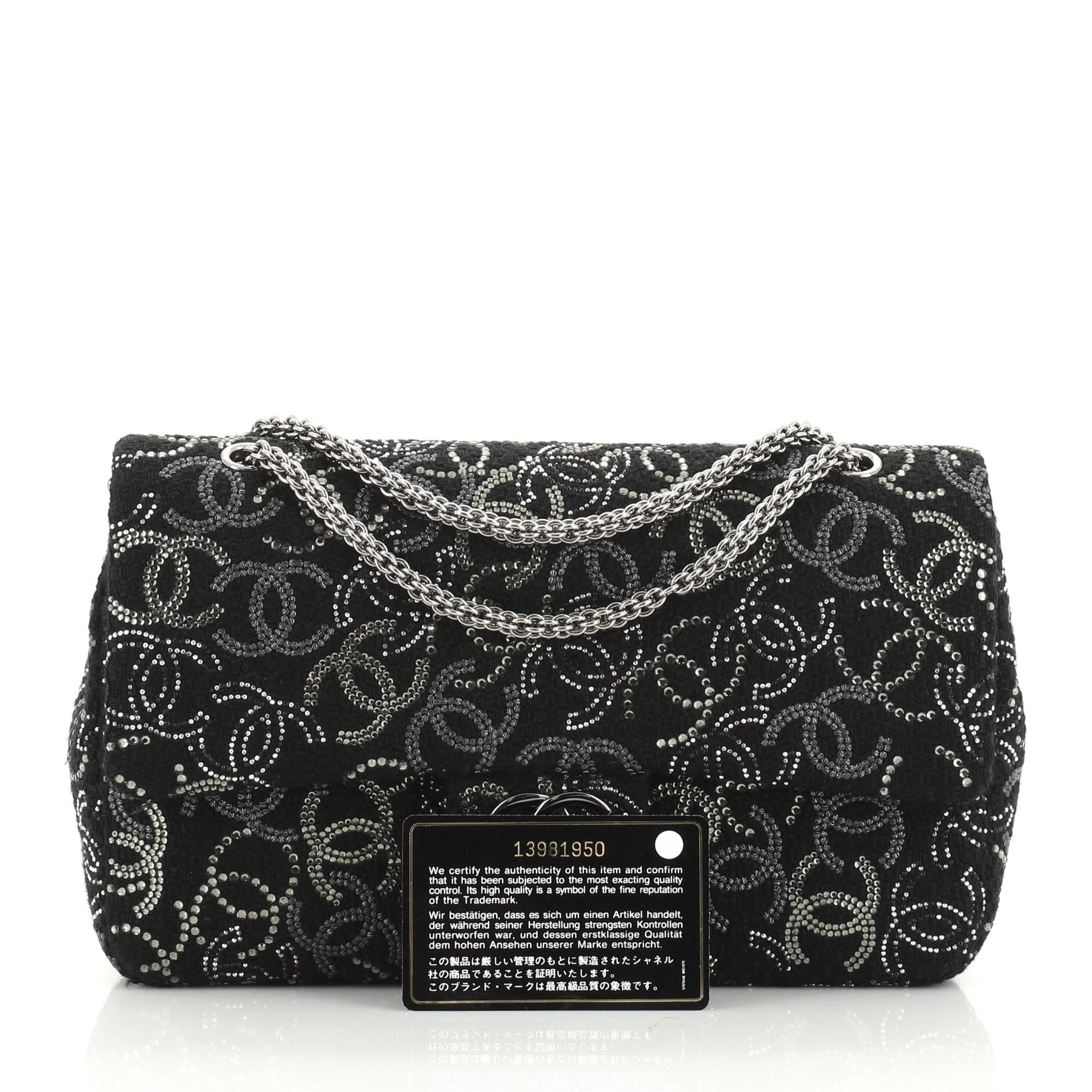 This Chanel Paris-Shanghai Pudong Flap Bag Strass Embellished Tweed Medium is a limited edition bag from the Pre-Fall 2010 Collection. Crafted from black strass embellished tweed, it features chain link shoulder strap, strass CC logo embroidery