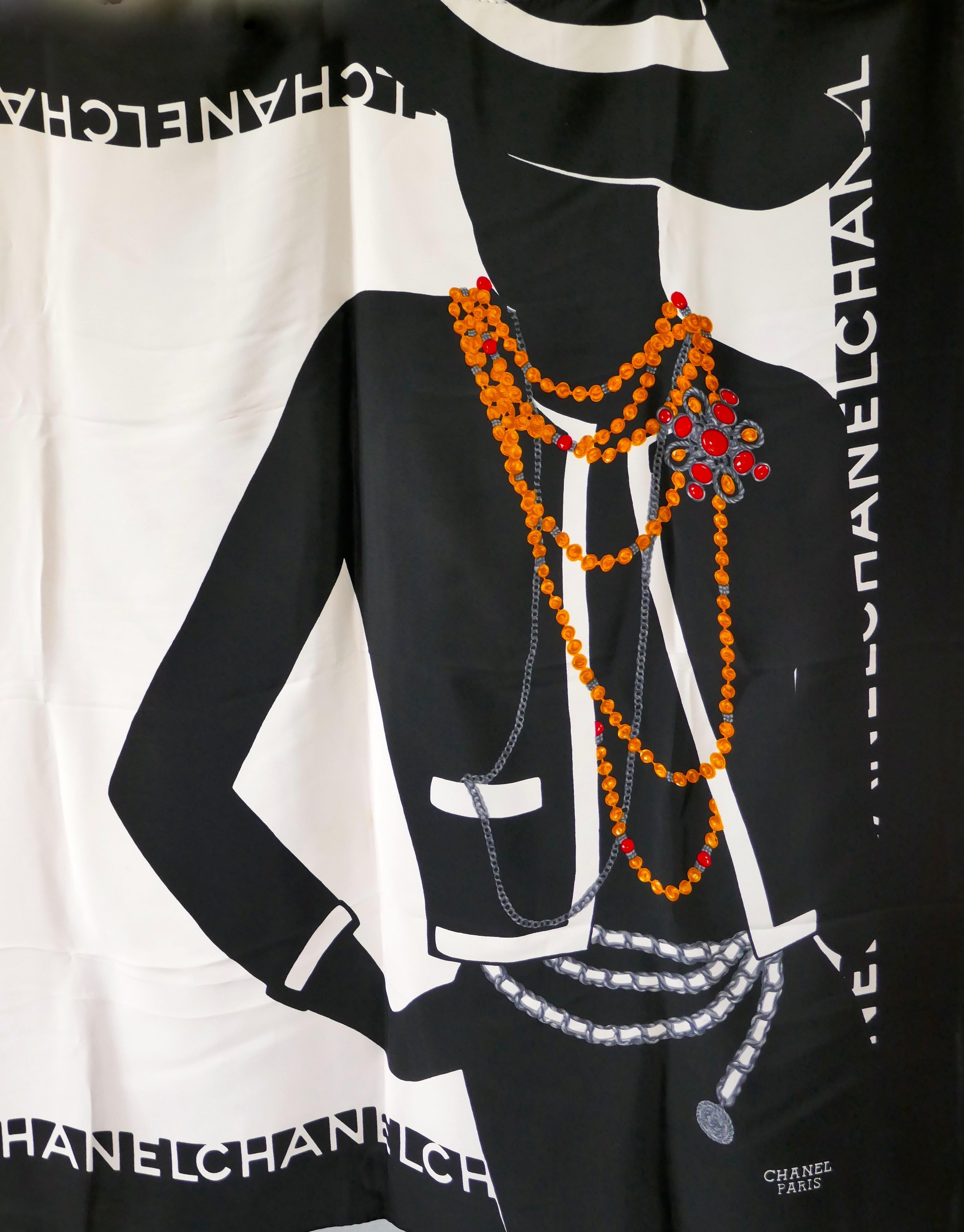 Chanel Paris Silk Scarf - Classic Chanel Black & White Blazer Design

Featuring Model in a Classic Chanel Black and White Blazer Suit with contrasting coloured necklaces and beads

The scarf in good condition and genuine Vintage some creasing no