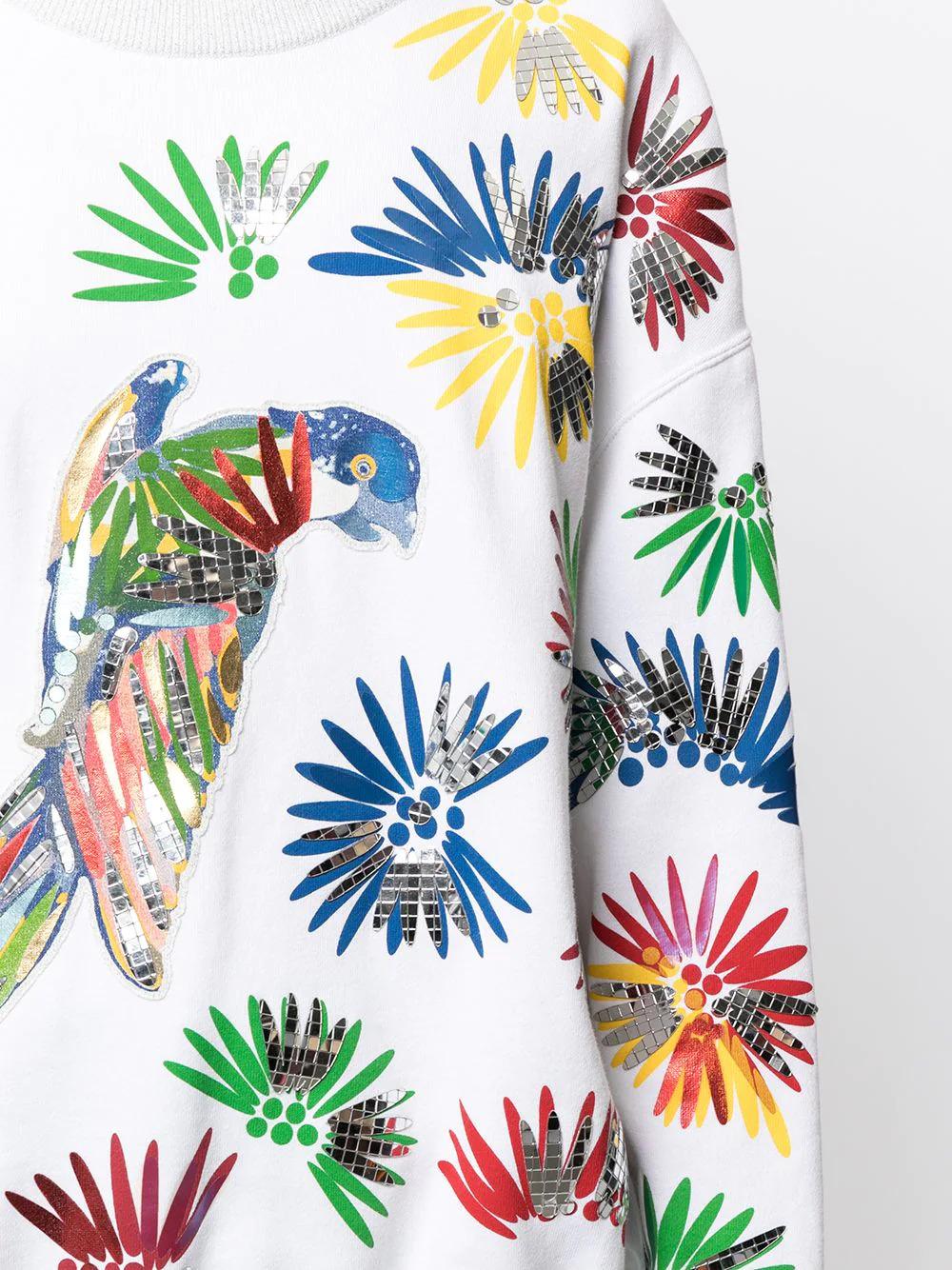 In 2017, Chanel hosted their Resort collection in Havana, inspired by the local culture. This vibrant piece from the collection features colourful parrots on white cotton, embellished with mirrored sequins. The crewneck pullover is in a straight