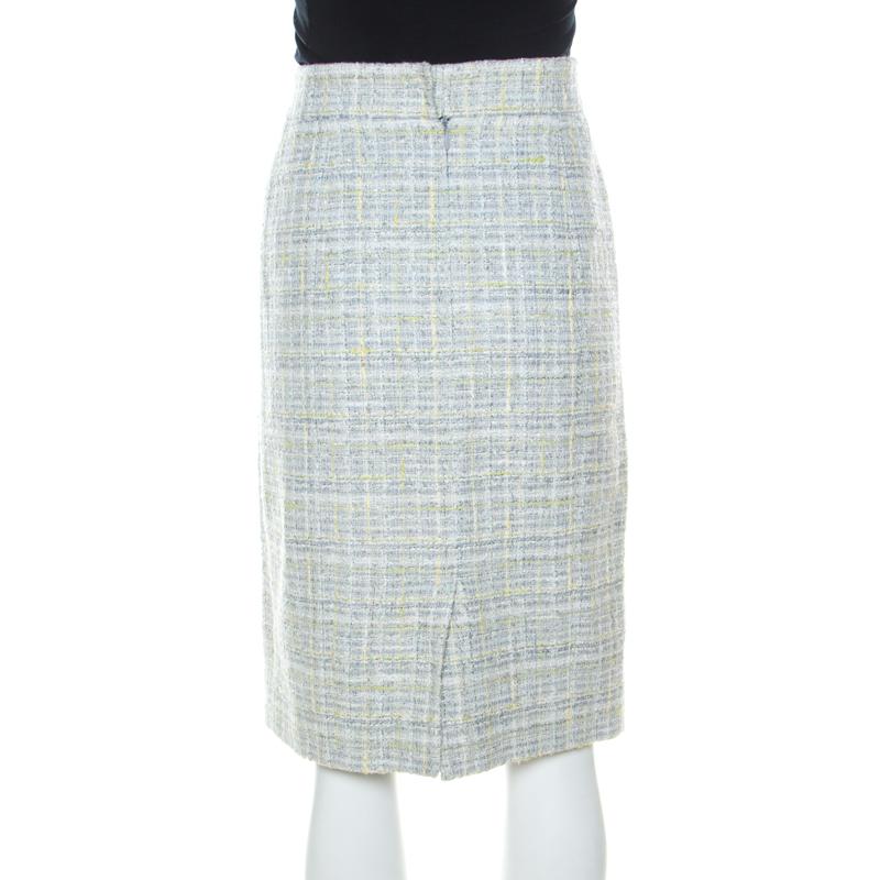 Team this pencil skirt with a pastel blouse and pumps to create a stunning look! Tailored from quality fabrics, it provides a sophisticated and charming appeal. Designed by Chanel, this skirt will be a treasured addition to your closet.

Includes: