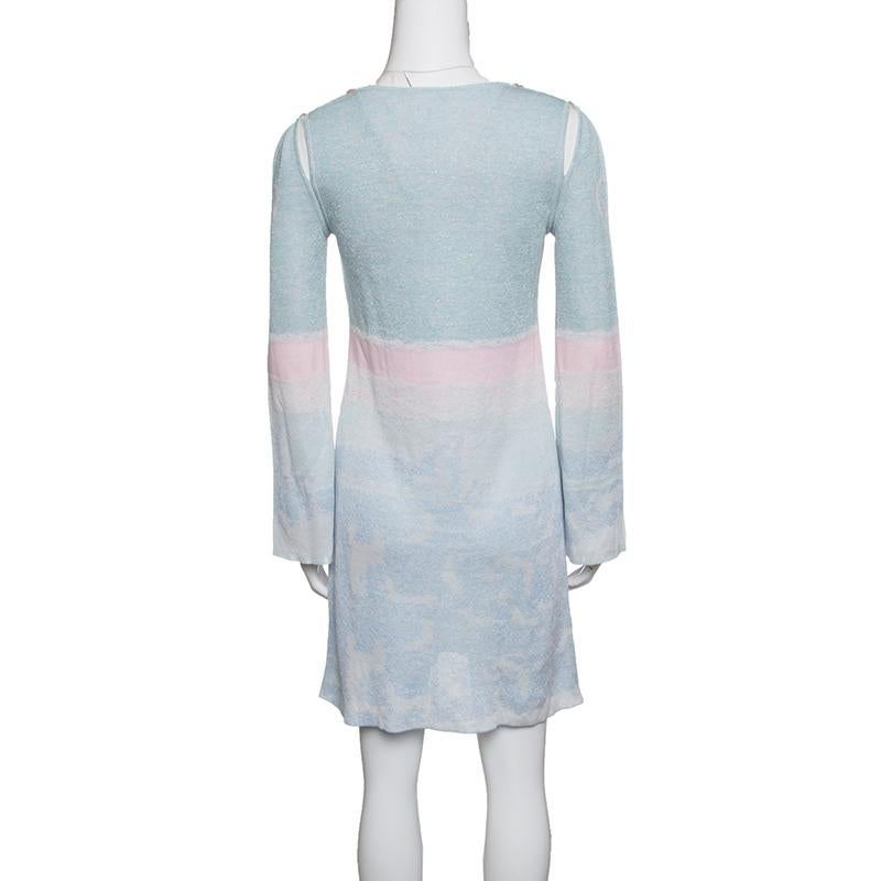 Your search for a chic and stylish tunic ends with this gorgeous creation from Chanel. The pastel lurex knit tunic is made of a blend of fabrics and features a simple silhouette. It flaunts a round neckline, long sleeves and creative cutout armhole