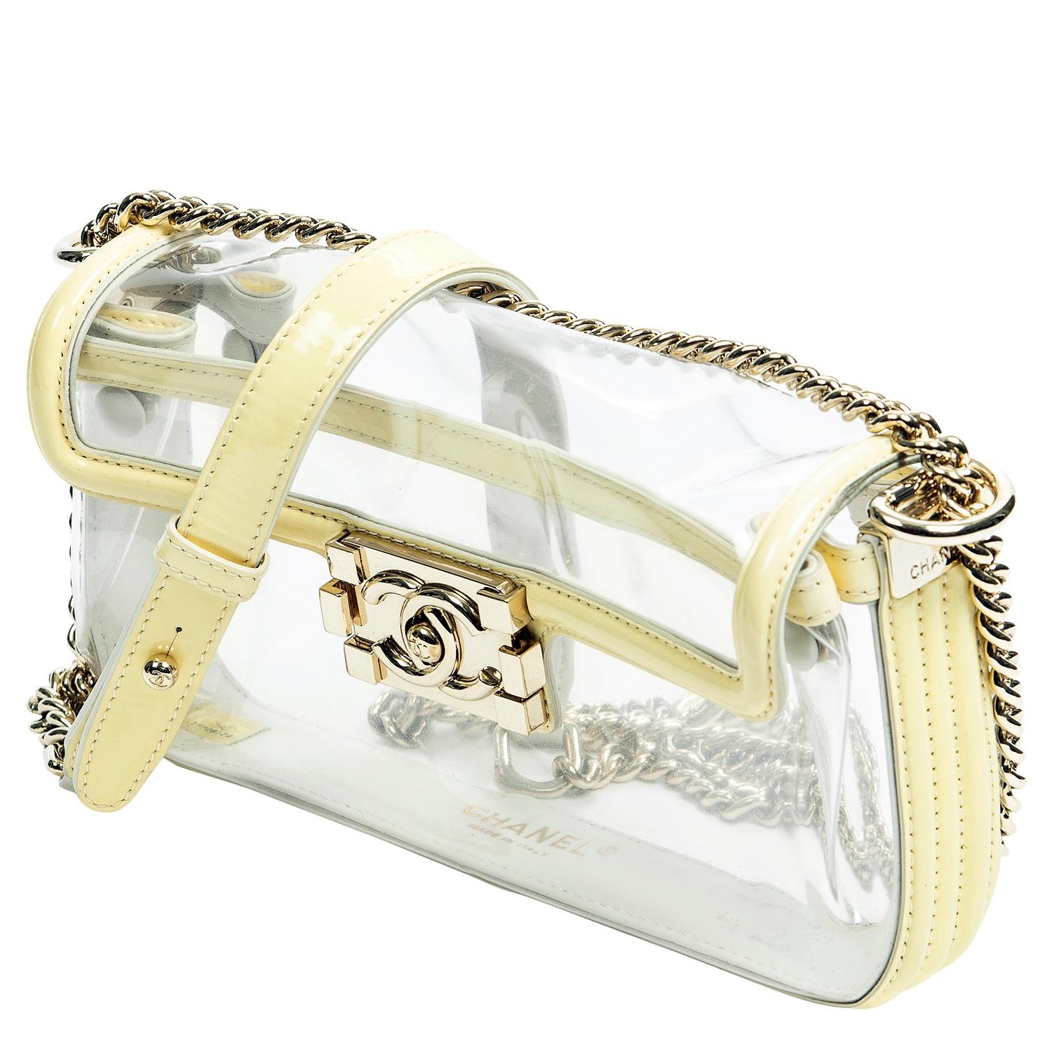 Super cute Chanel from 2012 crafted in PVC and pastel yellow leather trimming. We love the gold-tone hardware against the yellow and clear – it all works so well together. The CC pinch-lock closure opens up to a PVC interior. Dress her up or down as