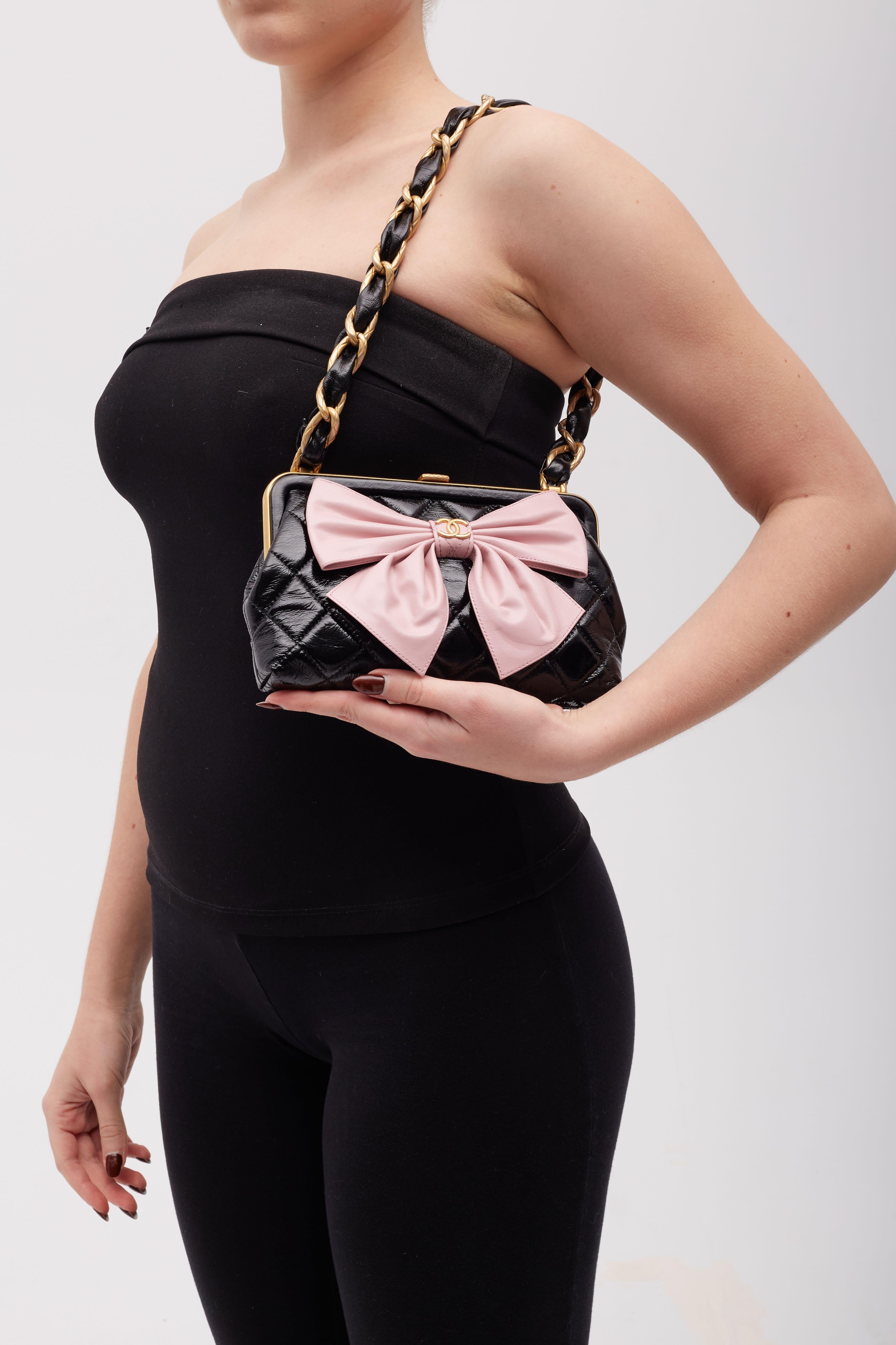 Designer Virginie Viard.
Color: black with gold hardware and pink
Material: patent lambskin and embellished with a pink leather flower 
Microchipped bag
Comes with: Dust bag and box
Condition: Very good. The bag is pristine.
Made in