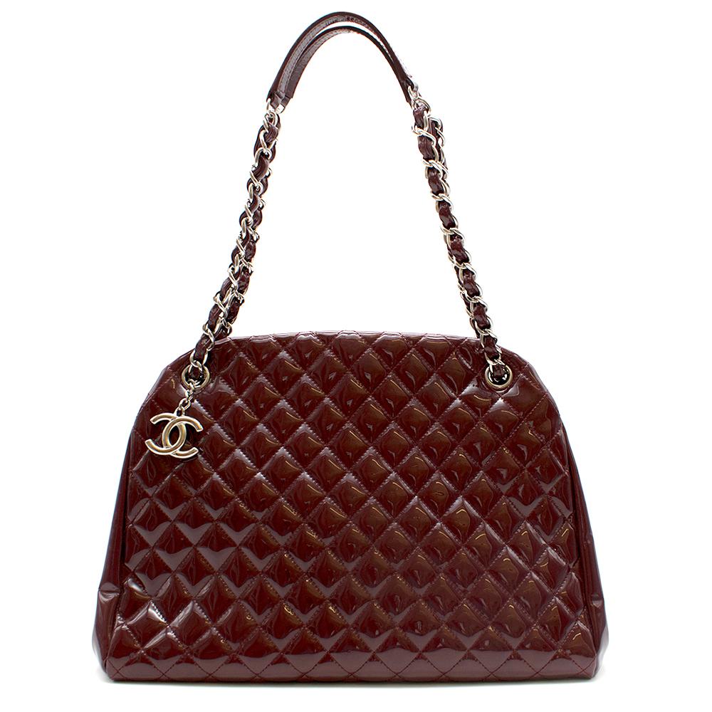 Chanel Patent Leather Burgundy Just Mademoiselle Bowling Bag

Patent leather Bowling Bag 
Quilted stitch design
Calfskin leather 
Metal chain and leather shoulder strap 
Iconic CC silver hardware logo 
Snap button closure
Three compartments,