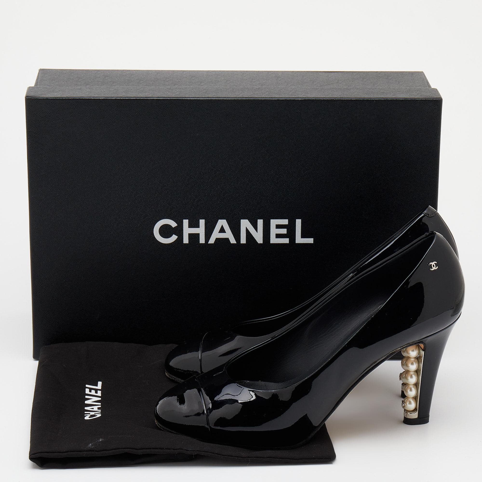 These pre-owned Chanel pumps come crafted from black patent leather in a round-toe silhouette. The faux pearls on the heels add the perfect finishing touch to the pair.

Includes: Original Dustbag, Original Box, Info Booklet, Extra Heel Tips