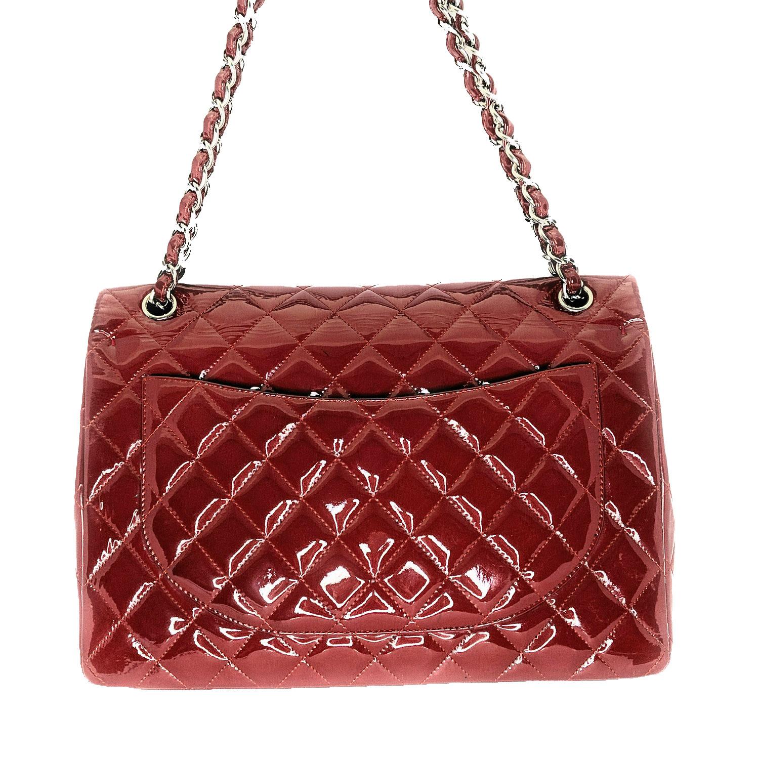 Prune diamond quilted Patent Calfskin leather Chanel Classic Maxi Double Flap bag with silver-tone metal hardware, convertible chain-link and leather shoulder strap, single patch pocket at back, single zip pocket at flap underside, three interior