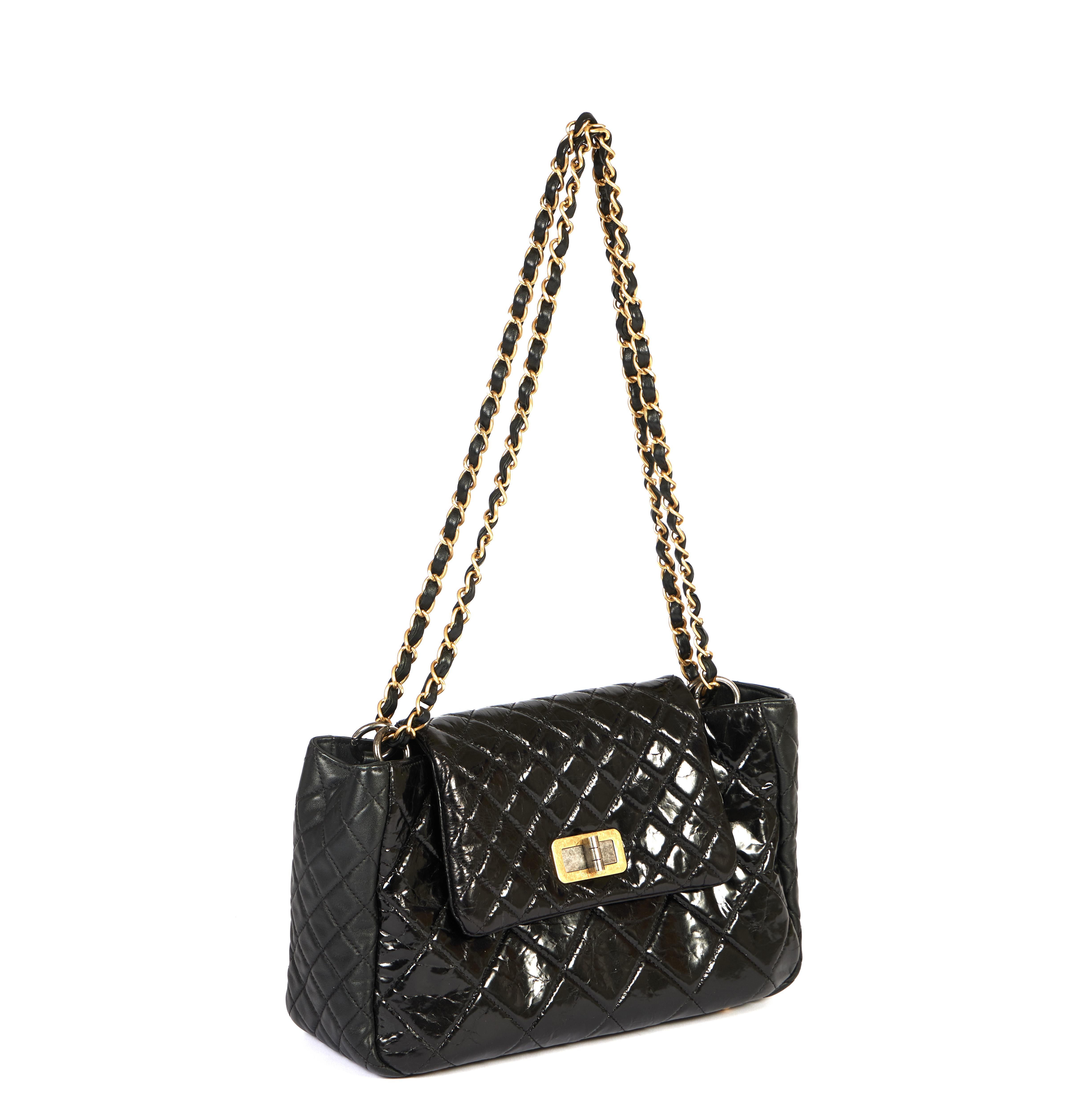 This reissue collection shoulder bag from Chanel comes in classic patent black with a golden chain. Mix of gold and ruthenium hardware. The shoulder drop is 12 inches and the bag can easily be worn cross body as well. According to the hologram