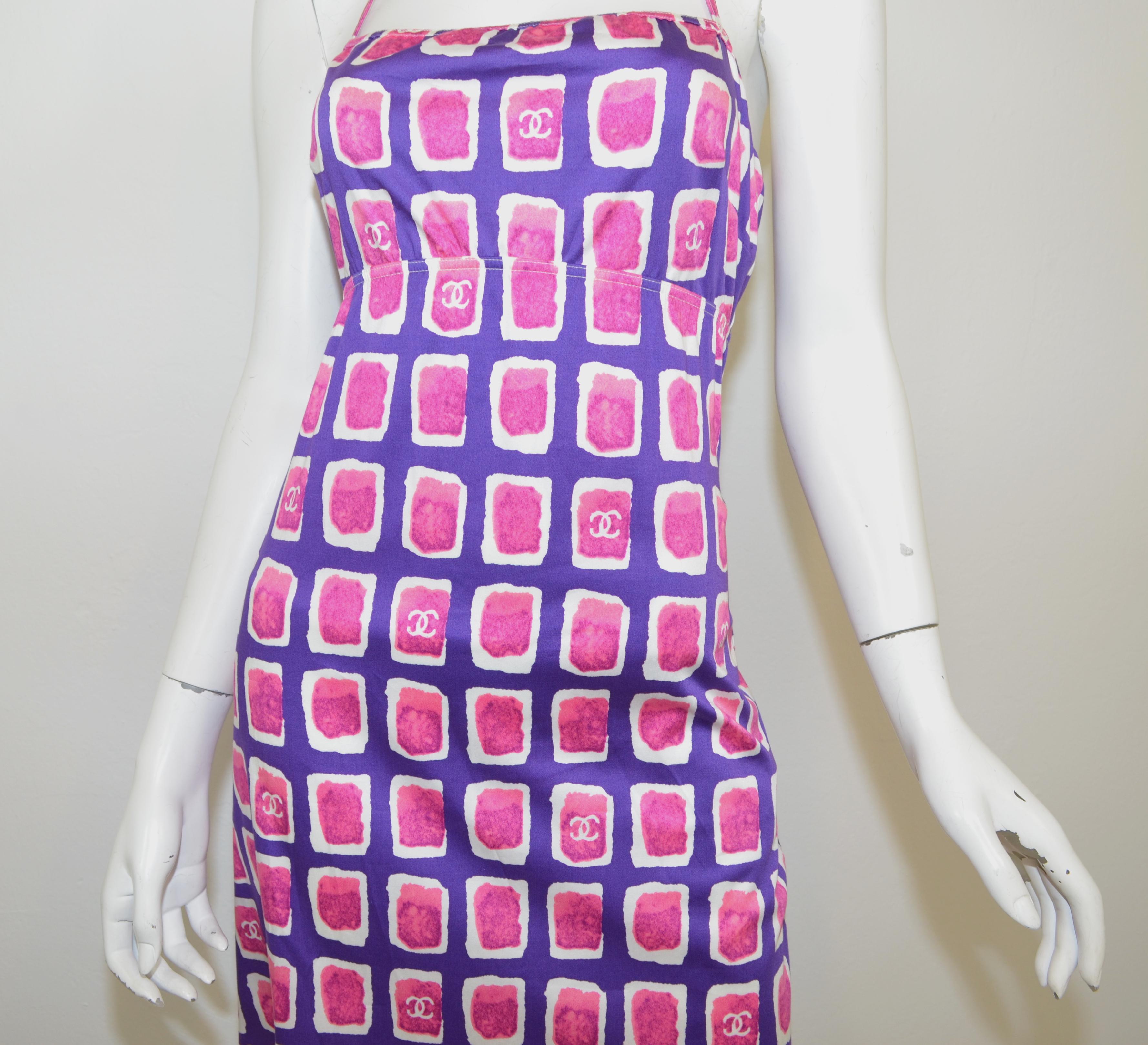 Chanel cotton blend halter dress, from 2001P, Bright purple, pink and white print with Chanel's  CC logo throughout the print. Dress has a back zipper fastening. Fabric Content is Cotton: 70%, Rayon: 26%, Spandex: 4%. Designer size 42. Made in