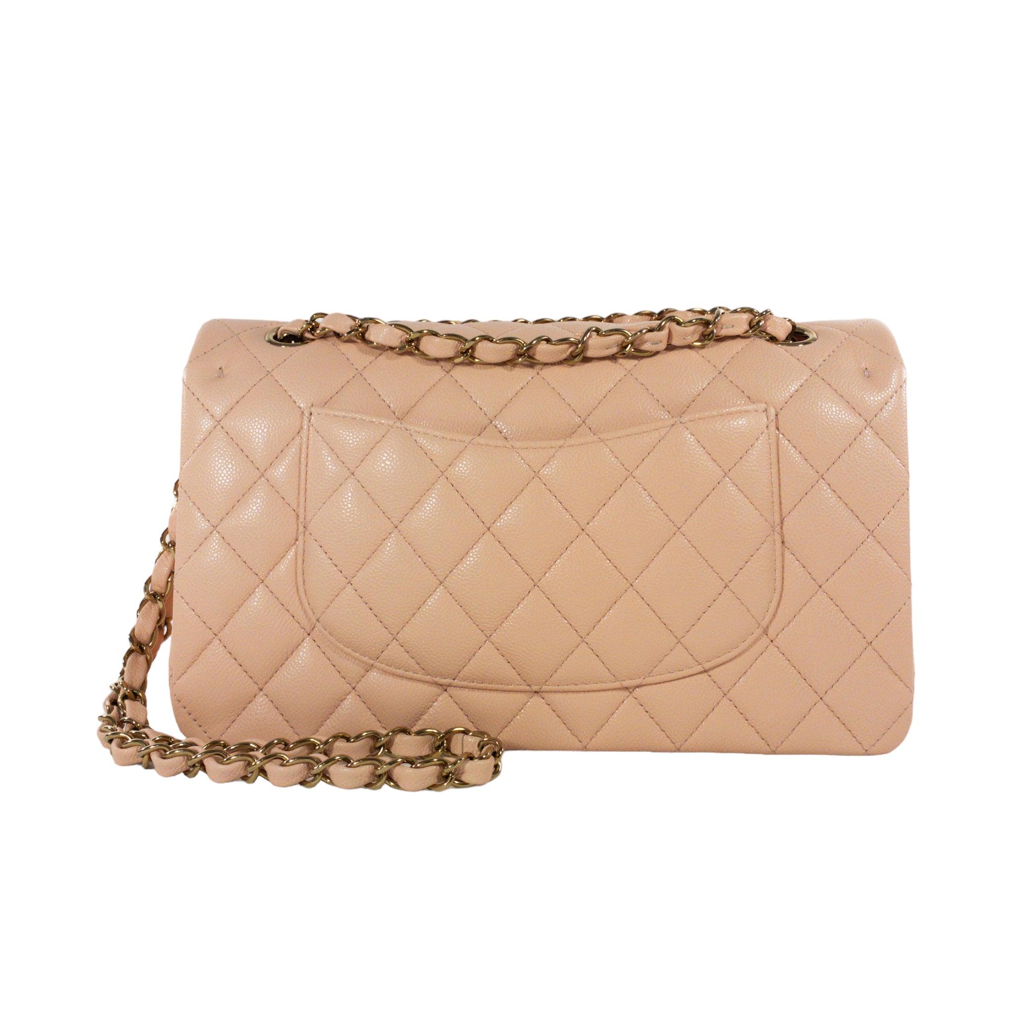 Chanel Peach Caviar Medium Flap GHW Bag

This is an authentic Chanel Medium Classic Flap. The bag has a flap closure with a Double C logo turn lock. The interior is leather and includes one slip pocket and one zip pocket, it also has one Exterior