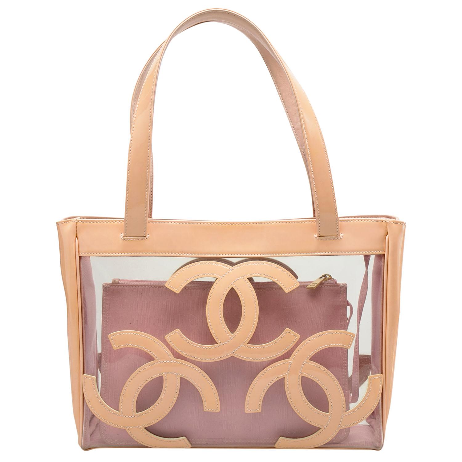 A lovely and unique creation from the house of Chanel, this Triple CC tote in medium size makes for an ideal bag for shopping outings, Sunday brunches and beach days. Rendered in clear PVC with light patent leather trims, the tote is styled three CC