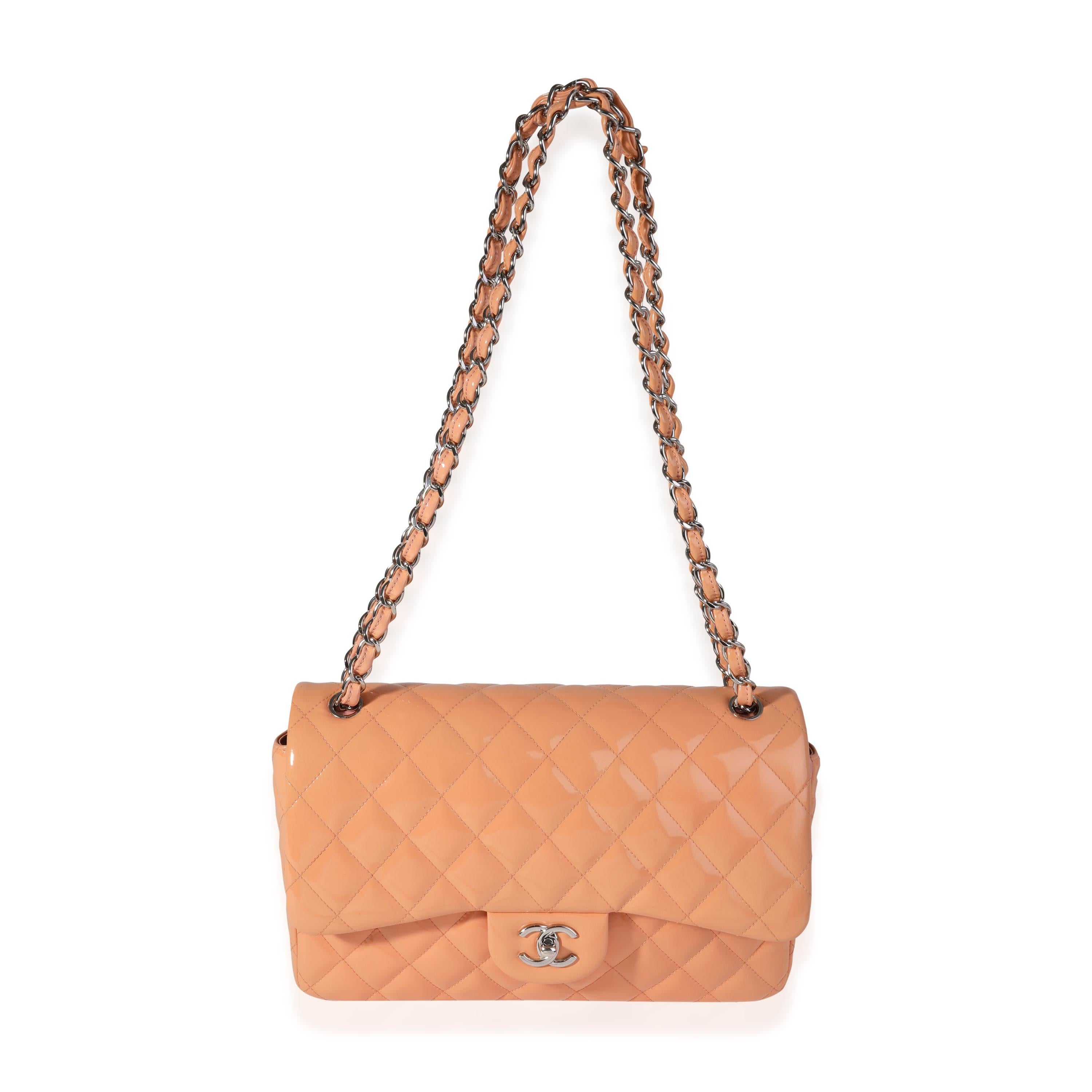 Listing Title: Chanel Peach Quilted Patent Leather Jumbo Classic Double Flap Bag
SKU: 121100
MSRP: 9500.00
Condition: Pre-owned 
Handbag Condition: Very Good
Condition Comments: Very Good Condition. Minor marks throughout exterior. Light scratching