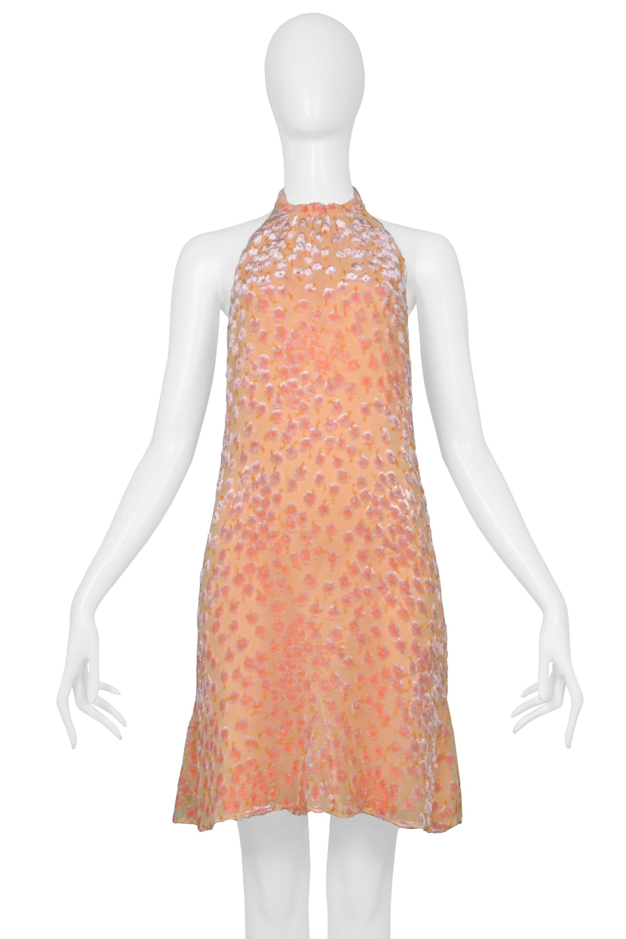 Resurrection Vintage is excited to offer a vintage Chanel by Karl Lagerfeld peach silk halter dress featuring iridescent cut velvet floral flowers, open back with cowl draping, button back and mini length .  

Chanel, Paris
Size 38
Fabric Silk and