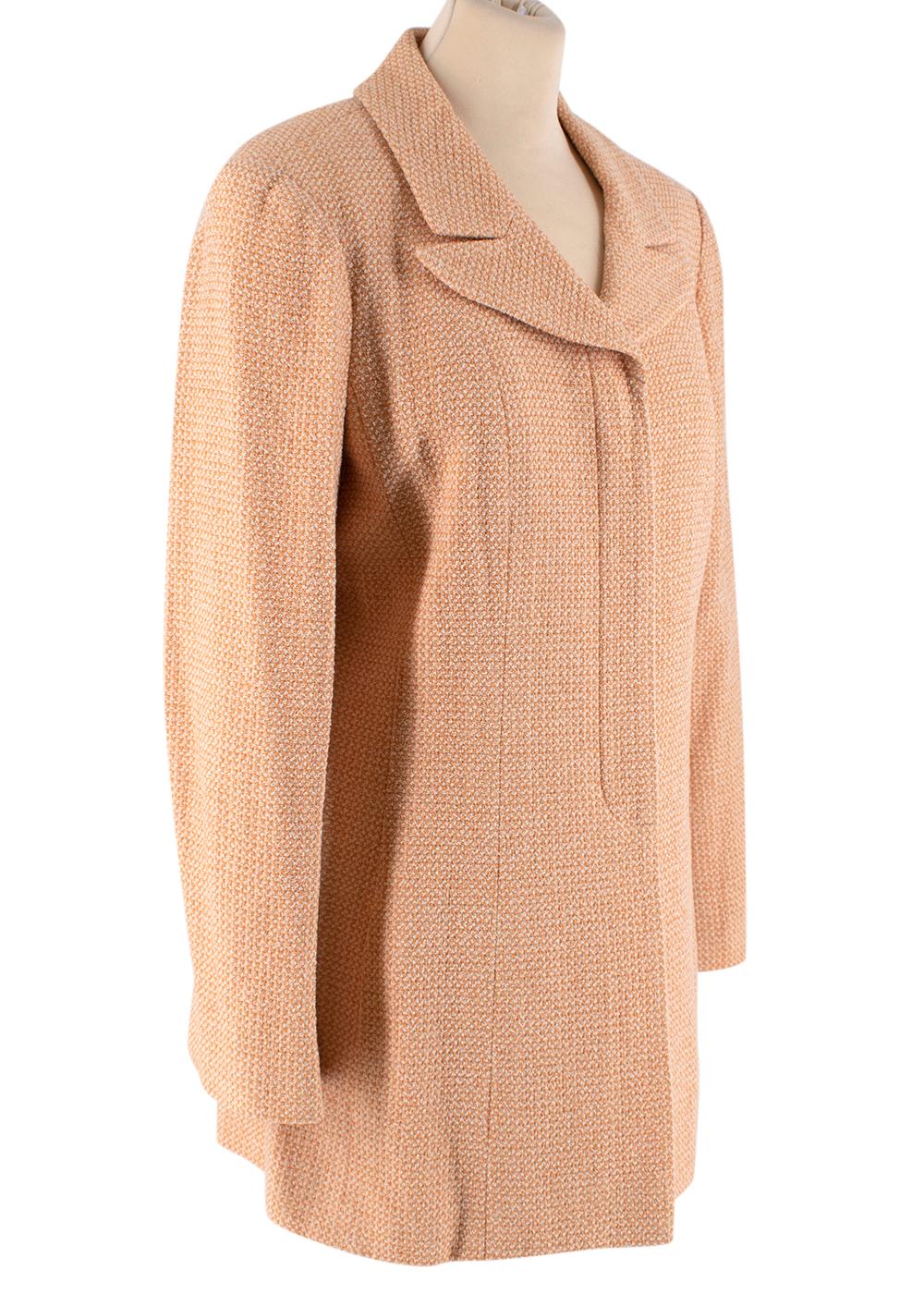 Chanel Peach Tweed Longline Jacket

- 2001 resort collection
-Classic design with peachy tones
-Four concealed buttons at the front
-Long-sleeve slit cuffs
- Large Peak Lapels
-Iconic CC gold logo embroidered on the left sleeve
-Fully lined with