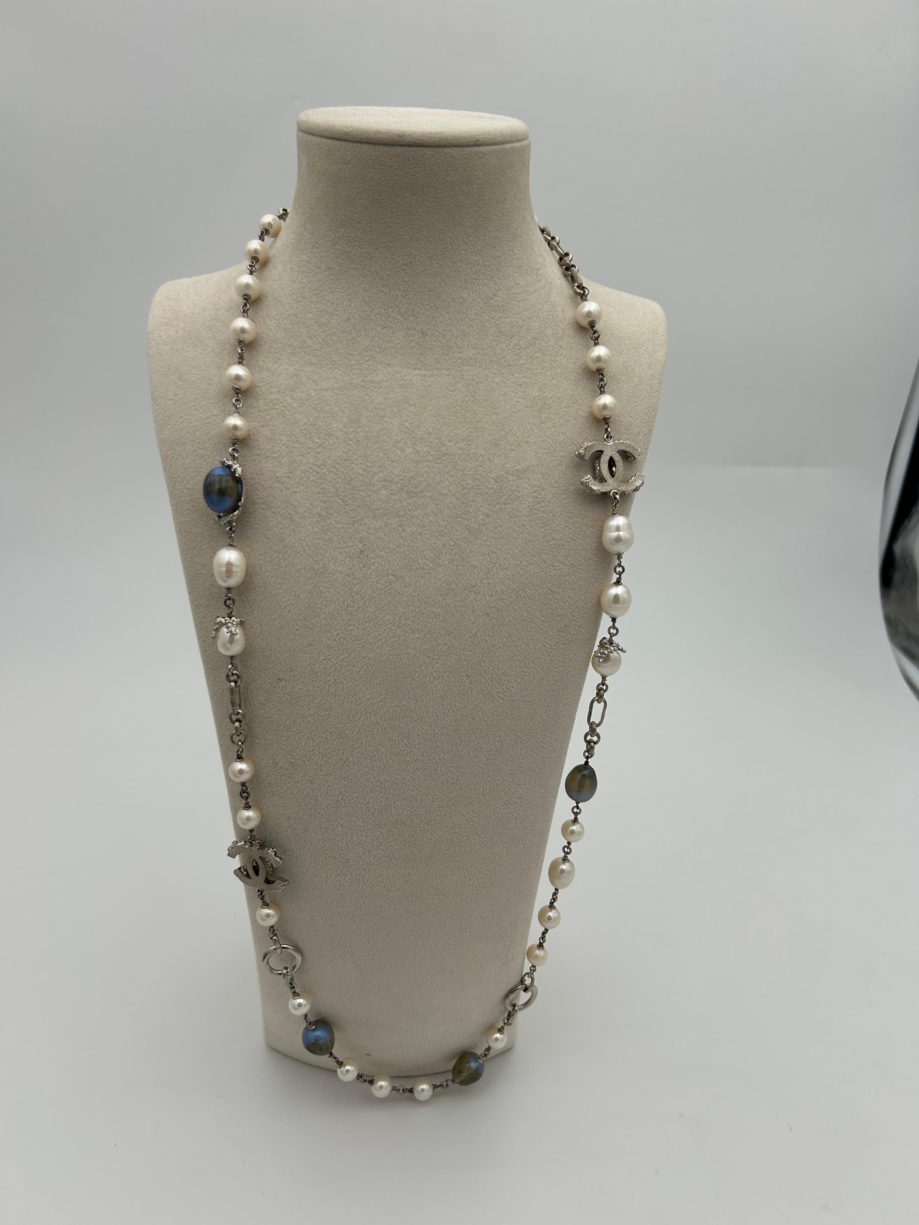 Chanel Pearl and Chain Necklace Summer/Spring 2012. In perfect condition, this necklace is a perfect statement of Chanel uniqueness and classiness. Iconic statement piece, this necklace can be worn several different ways, the colors are original and