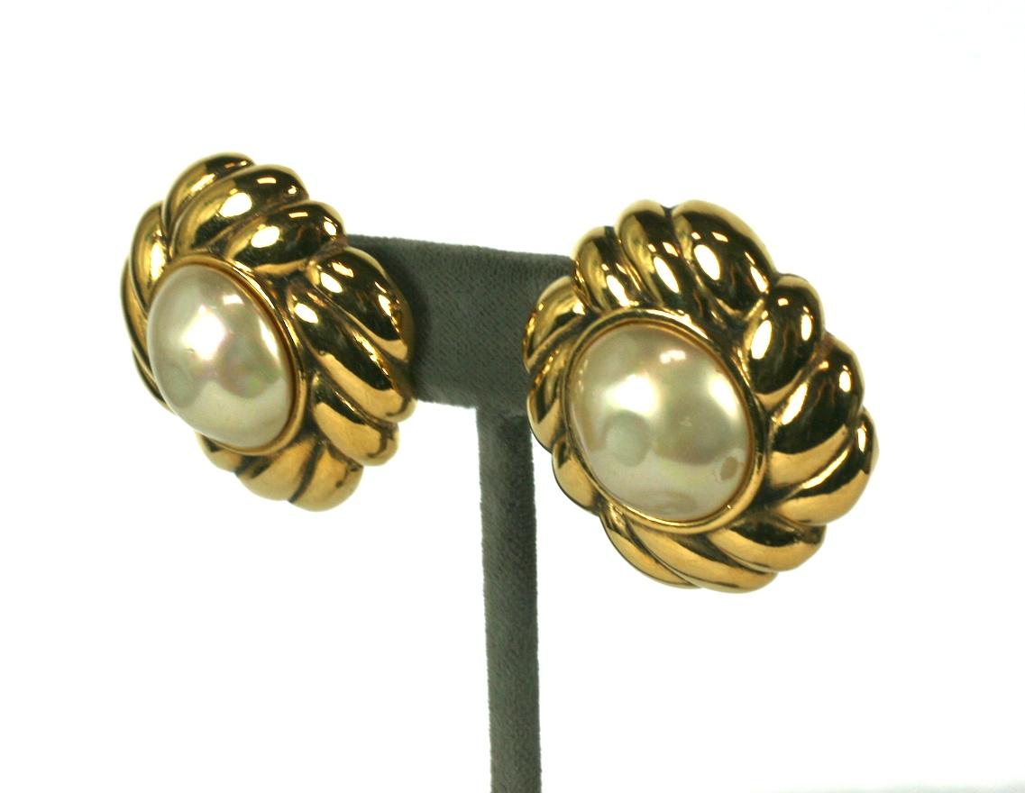 Chanel Pearl and Gilt Earrings from the 1990's. Large faux mabe pearls set into gilt rope style settings. Clip back fittings. 
Excellent condition. 1990's France.  1.25