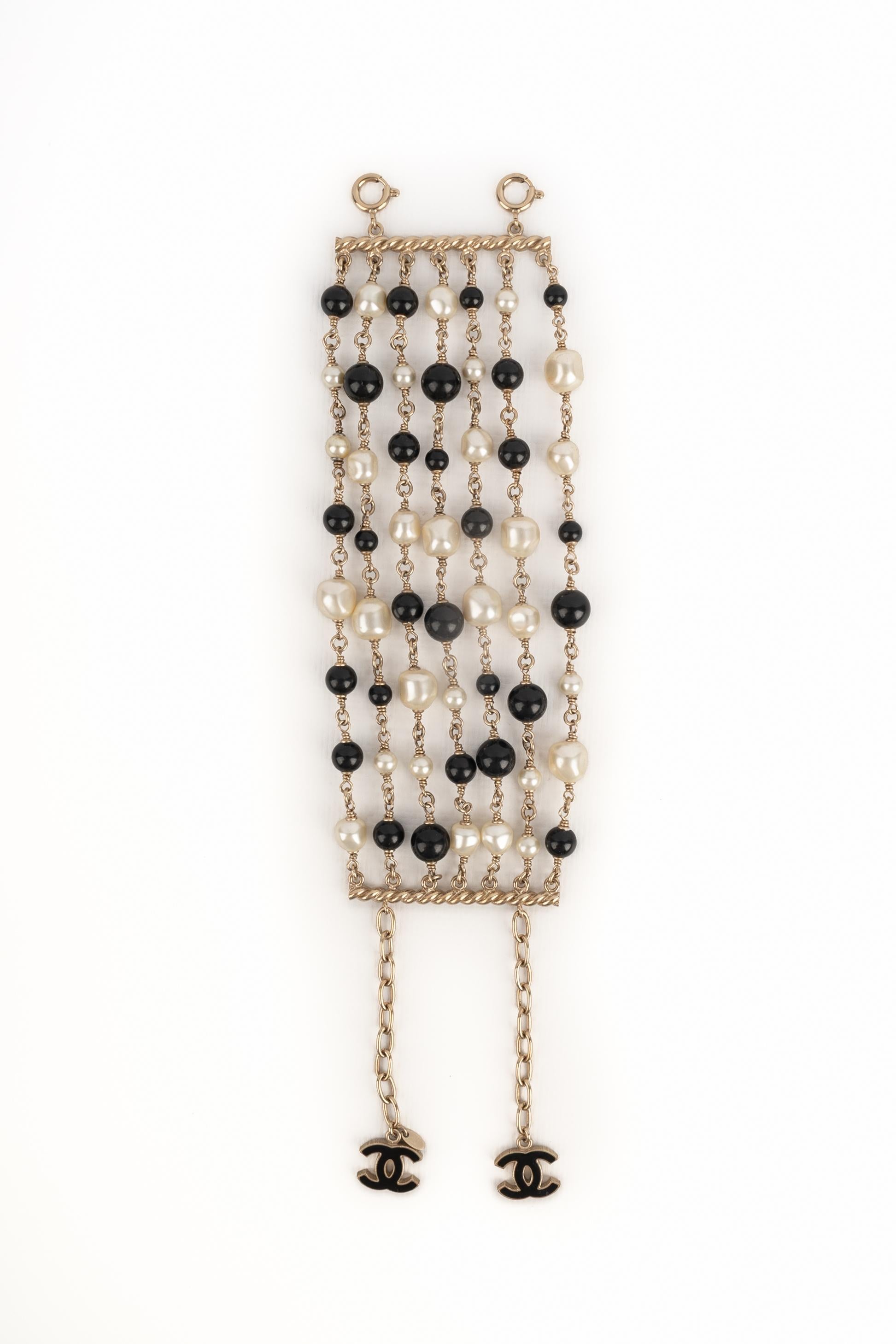 CHANEL - (Made in France) Pulsera con perlas de fantasía y perlas de cristal negro. Colección 2012.

Estado:
Muy buen estado

Dimensiones:
Longitud: de 16 cm a 22 cm

SKU:BRAB139