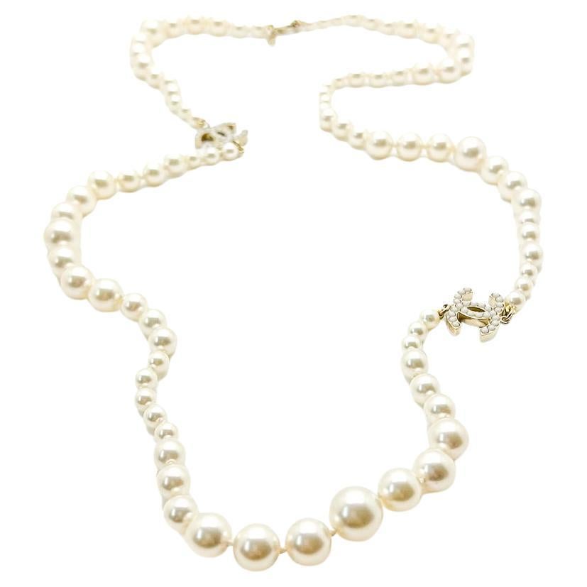 A totally timeless Chanel Pearl Logo Rope Necklace. The pearl rope necklace, embellished with the iconic interlocking CCs is perhaps the House of Chanel's most quintessential piece. Utterly timeless and versatile the necklace will steal the show on