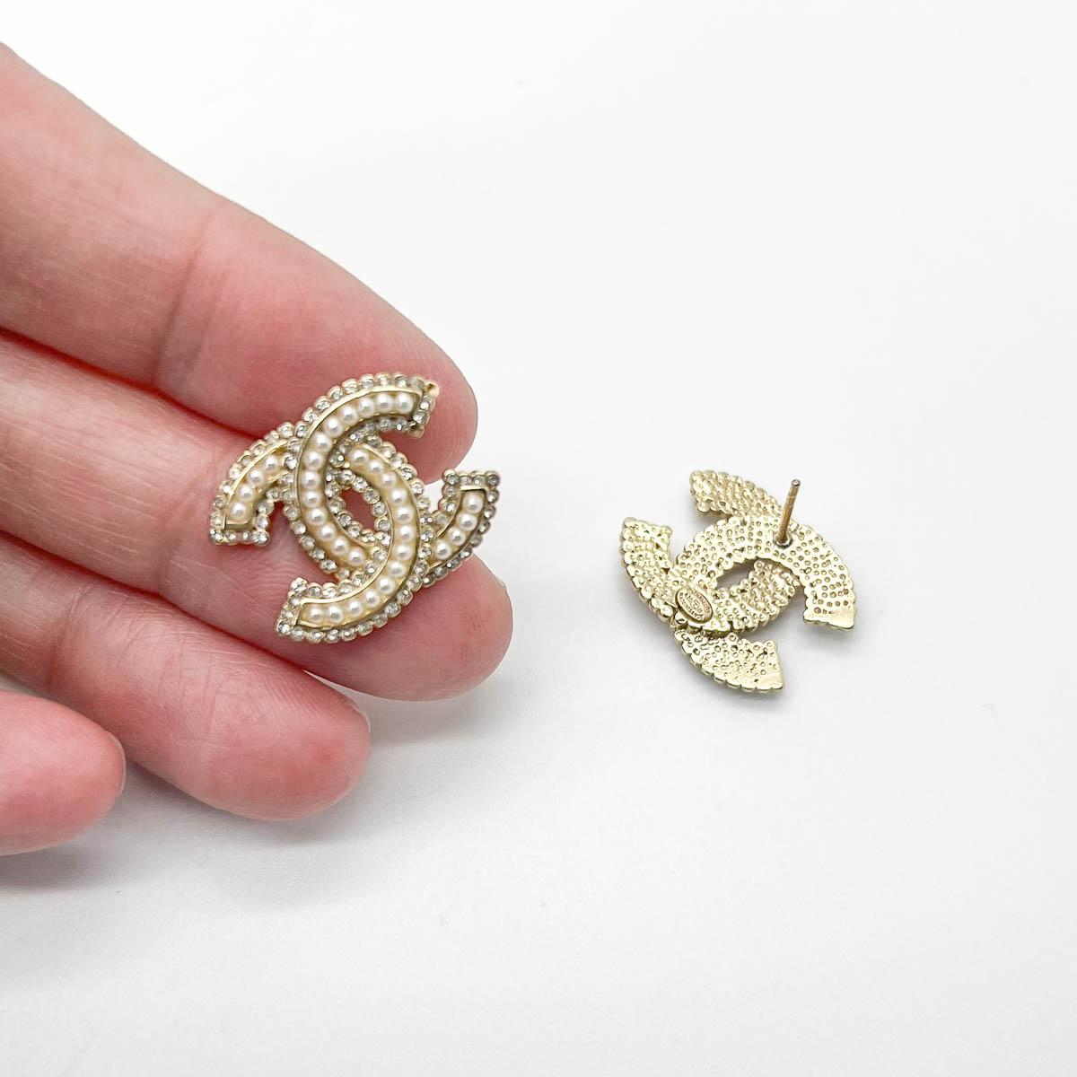 A pair of Chanel CC Pearl Earrings. The quintessential style statement. Pearls and crystals adorn the most iconic logo in the world for a demure look.

Who wouldn’t want to own a piece of vintage Chanel jewellery? A major part of her eponymous House