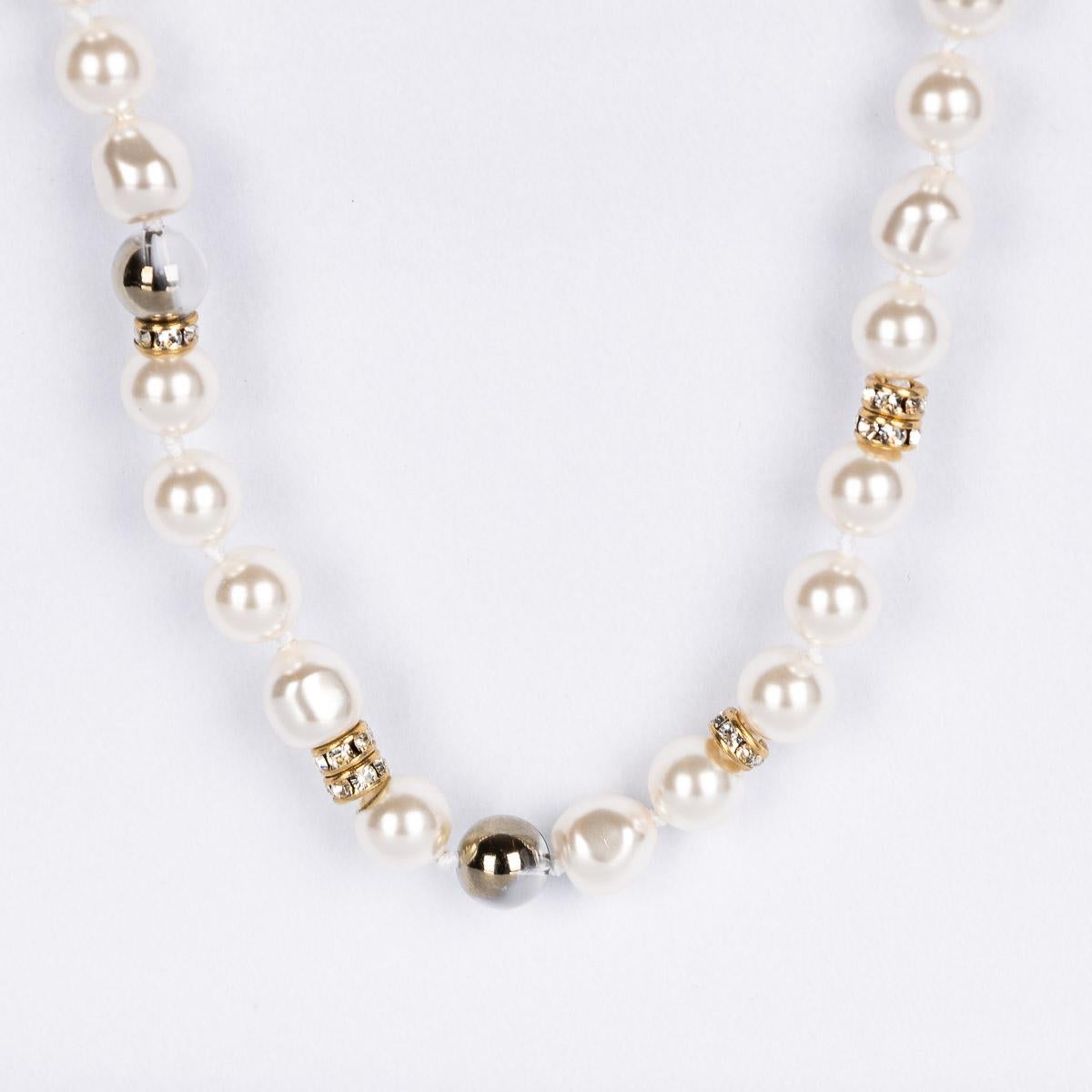 A stylish long Chanel necklace crafted from pearls, transparent beads and gold plated metal 