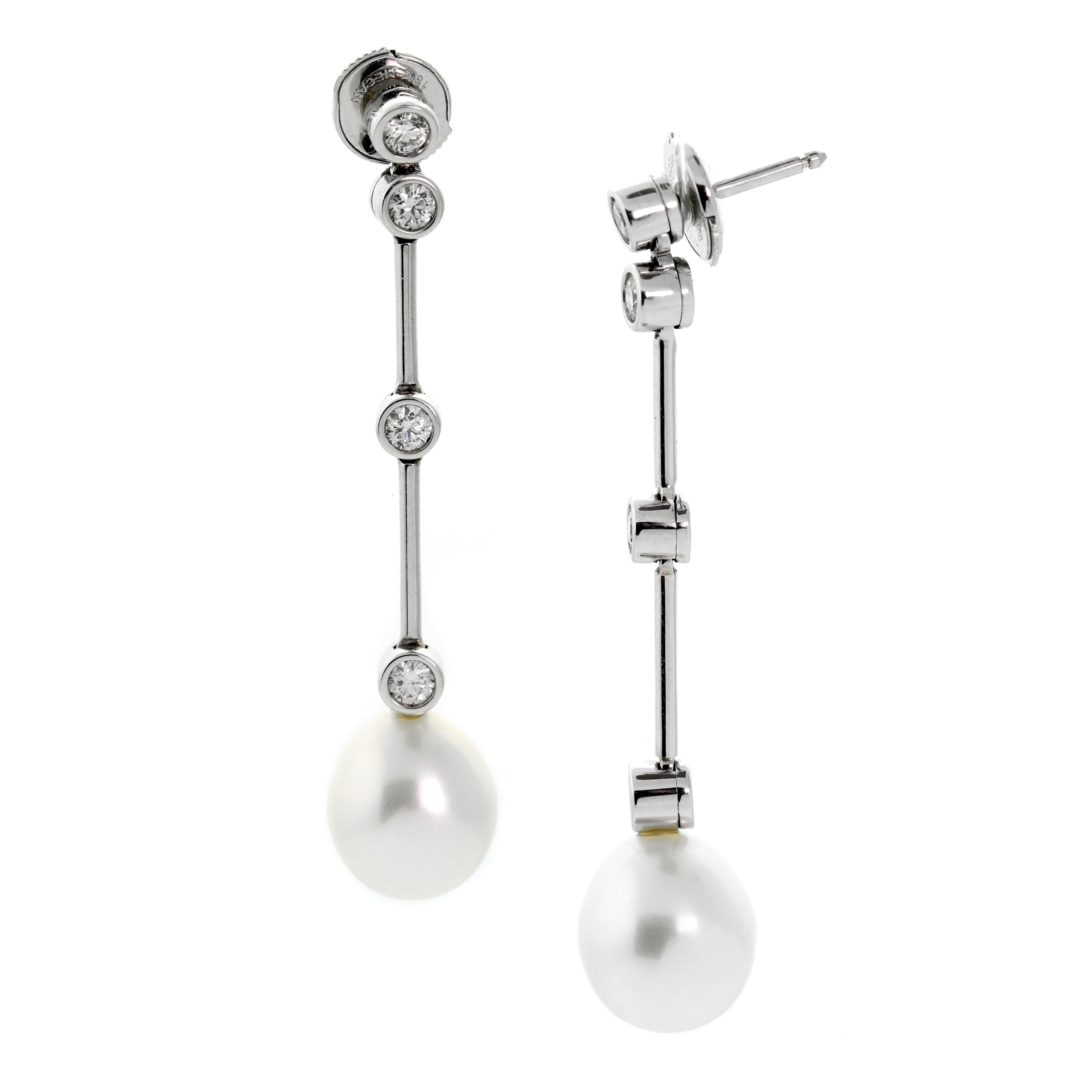 A fabulous pair of Chanel white gold drop earrings, 1.92 inches long, accented by the finest Chanel round brilliant cut diamonds set in 18k white gold. The earrings are fashioned in lengths of white gold that intermittently showcase a diamond, and