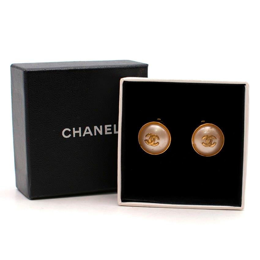 Chanel Pearl Earrings

- Gold-tone hardware
- Pearl centre
- 'CC' gold-tone logo to the centre of each pearl
- Clip on fastening
- Gold-Plated & Pearl

Please note, these items are pre-owned and may show some signs of storage, even when unworn and