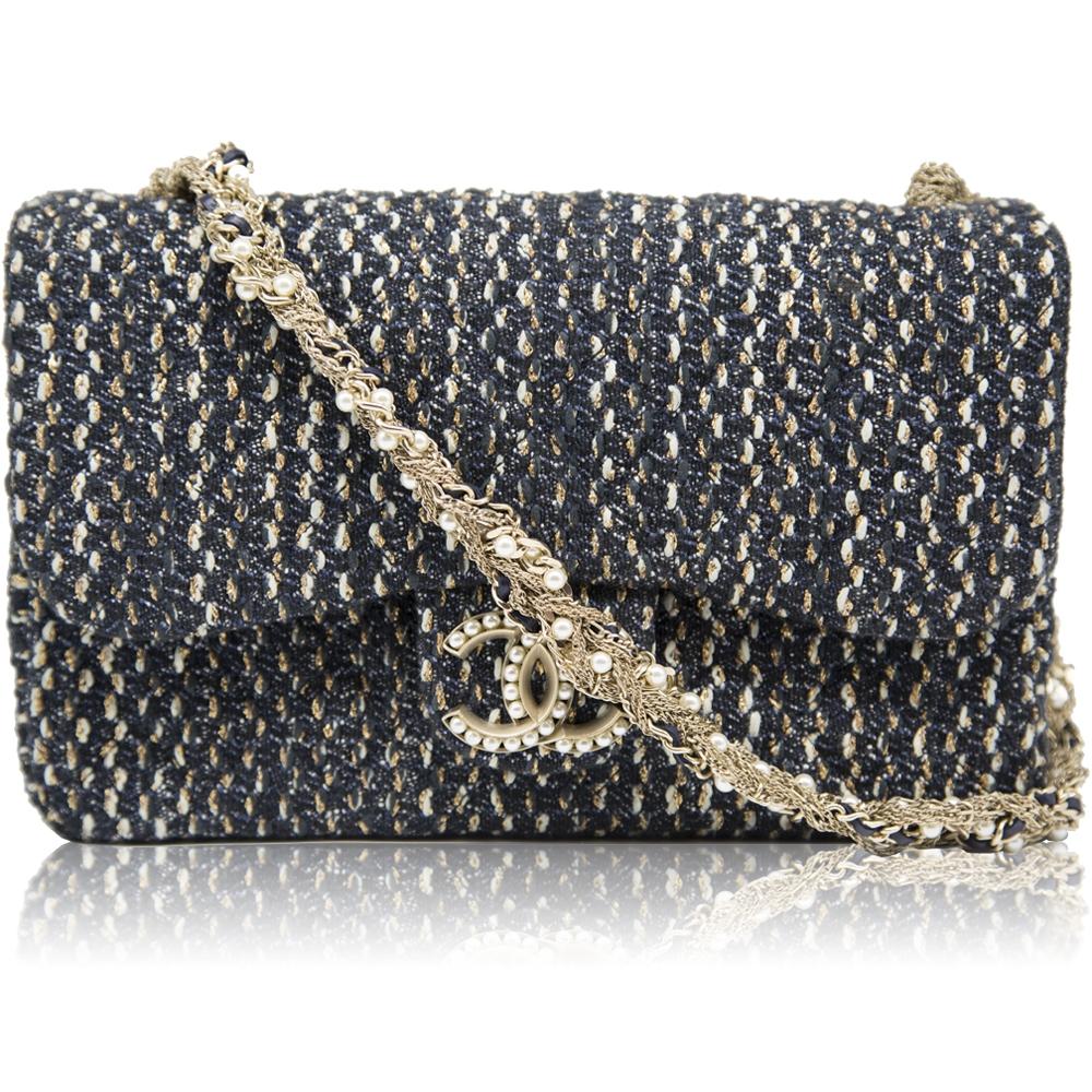Crafted in France from pure wool, this 2015 Westminster Flap Bag by Chanel is finished with gold-tone hardware and the classic CC turn lock. Featuring a foldover top, a main internal compartment, an internal zipped pocket, a knitted style and pearl