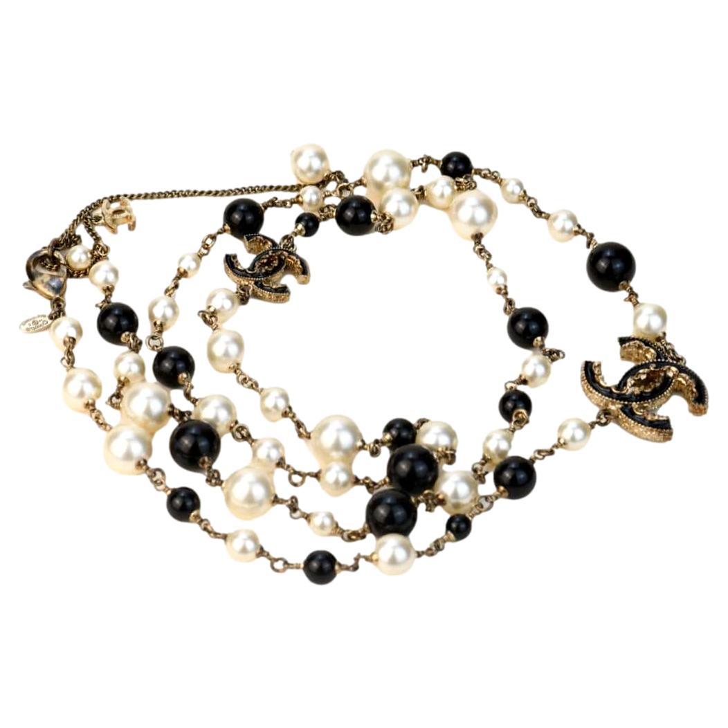 Chanel Pearl Enamel CC Long Necklace Black Gold at 1stDibs  cc stamp on  jewelry, chanel black and white pearl necklace