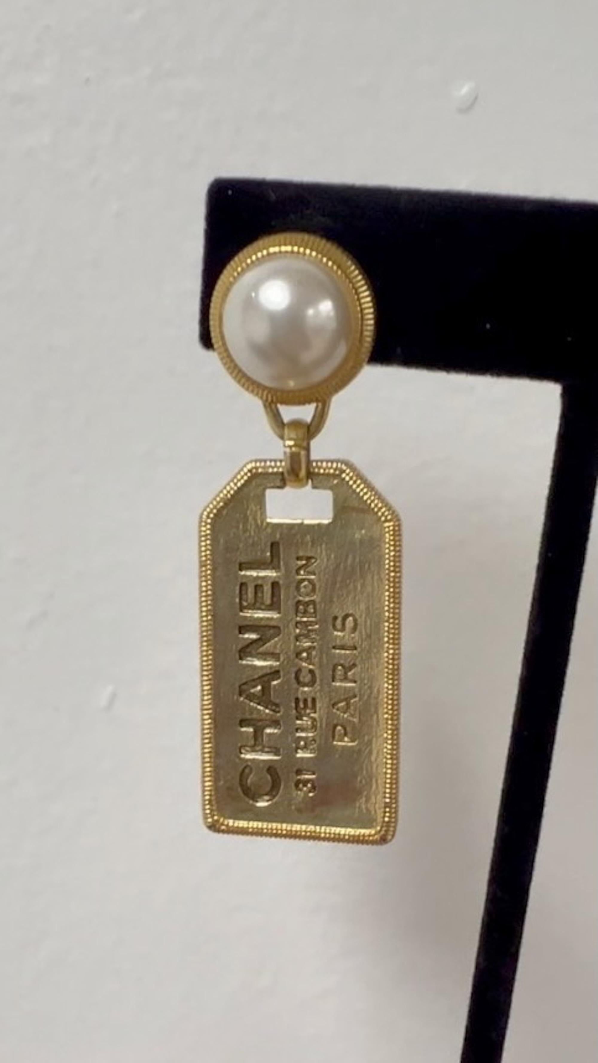 Women's or Men's Chanel Pearl Gold Signature Tag Drop Earrings Mini For Sale