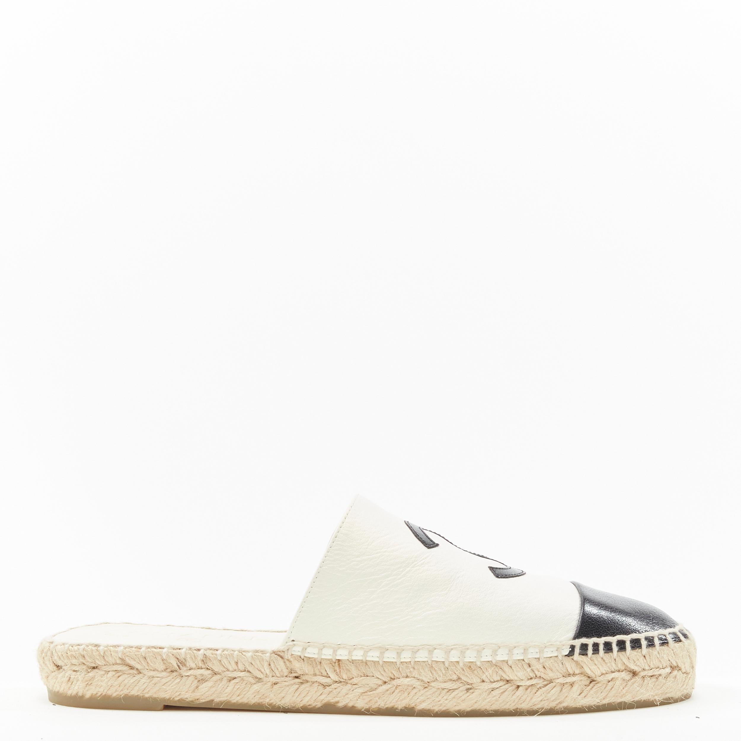 CHANEL pearl sheen white leather black CC toe cap espadrille jute sole mule EU38 Reference: LNKO/A01897 
Brand: Chanel 
Material: Leather 
Color: White 
Pattern: Solid 
Extra Detail: BG33553. Pearlescent iridescent white leather. Black GG logo and