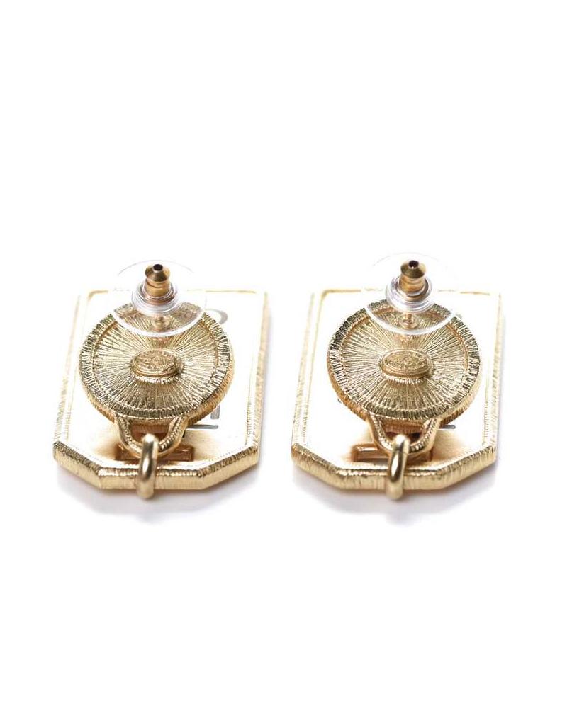 This stunning and classic Chanel earrings feature large resin pearls and gold metal tags engraved with the 31 Rue Cambon address, the flagship location of Chanel in Paris.

- In the picture with light these earrings look light gold, but in real life