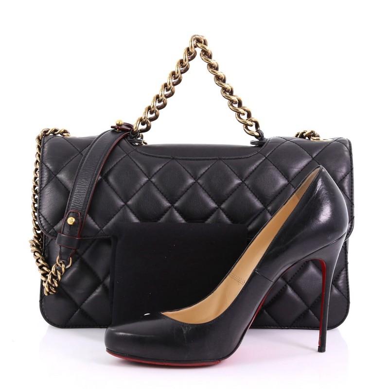 This Chanel Perfect Edge Flap Bag Quilted Calfskin Jumbo, crafted in black quilted calfskin leather, features a short chain handle, longer chain link strap with leather shoulder pad, and aged gold-tone hardware. Its CC turn-lock closure opens to a