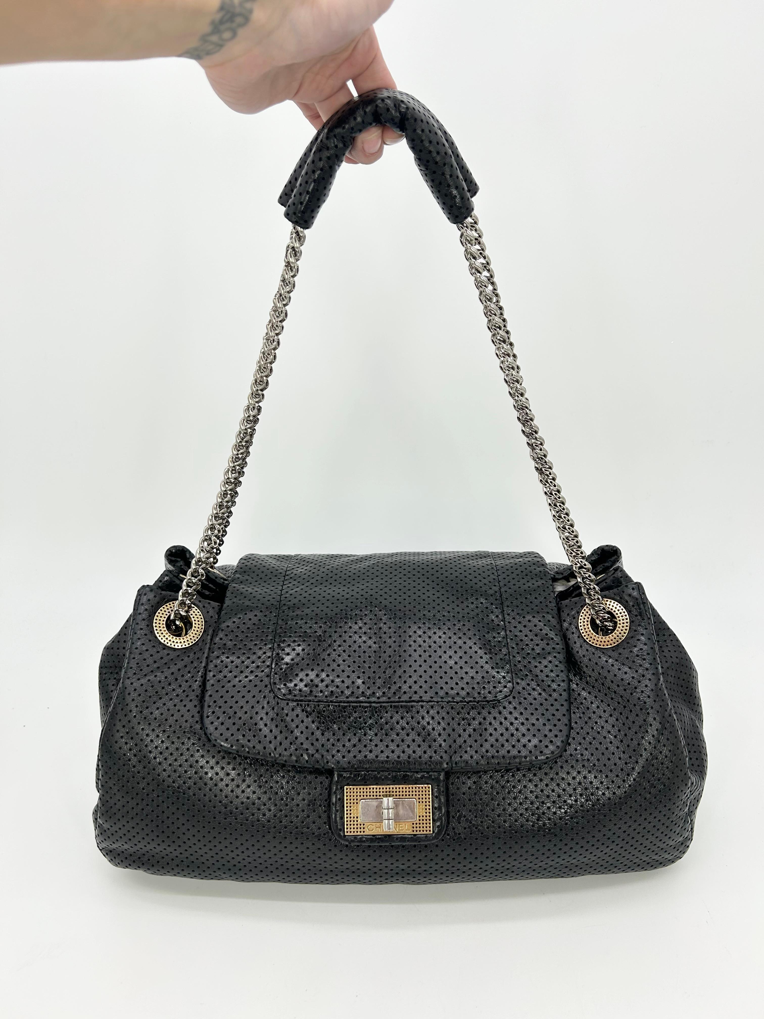Chanel Perforated Drill Flap Accordion Classic In very good condition. Soft black perforated leather body trimmed with gold hardware and sparkling silver chain shoulder strap handle. Unique accordion style with expandable sides. Leather pad on