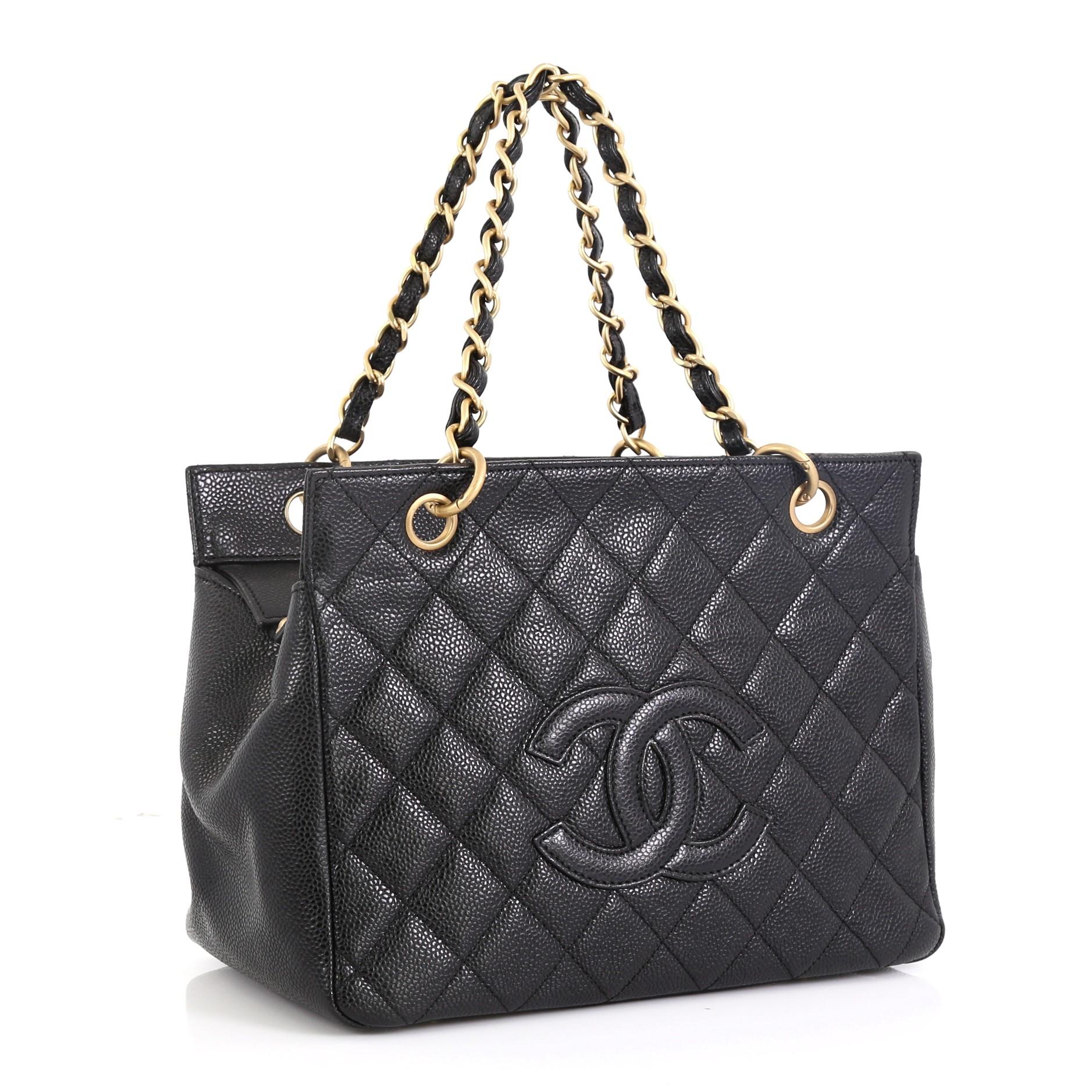 This Chanel Petite Timeless Tote Quilted Caviar, crafted in black quilted caviar leather, features dual woven-in leather chain link straps, interlocking CC logo, and matte gold-tone hardware. Its zip closure opens to a black leather interior with