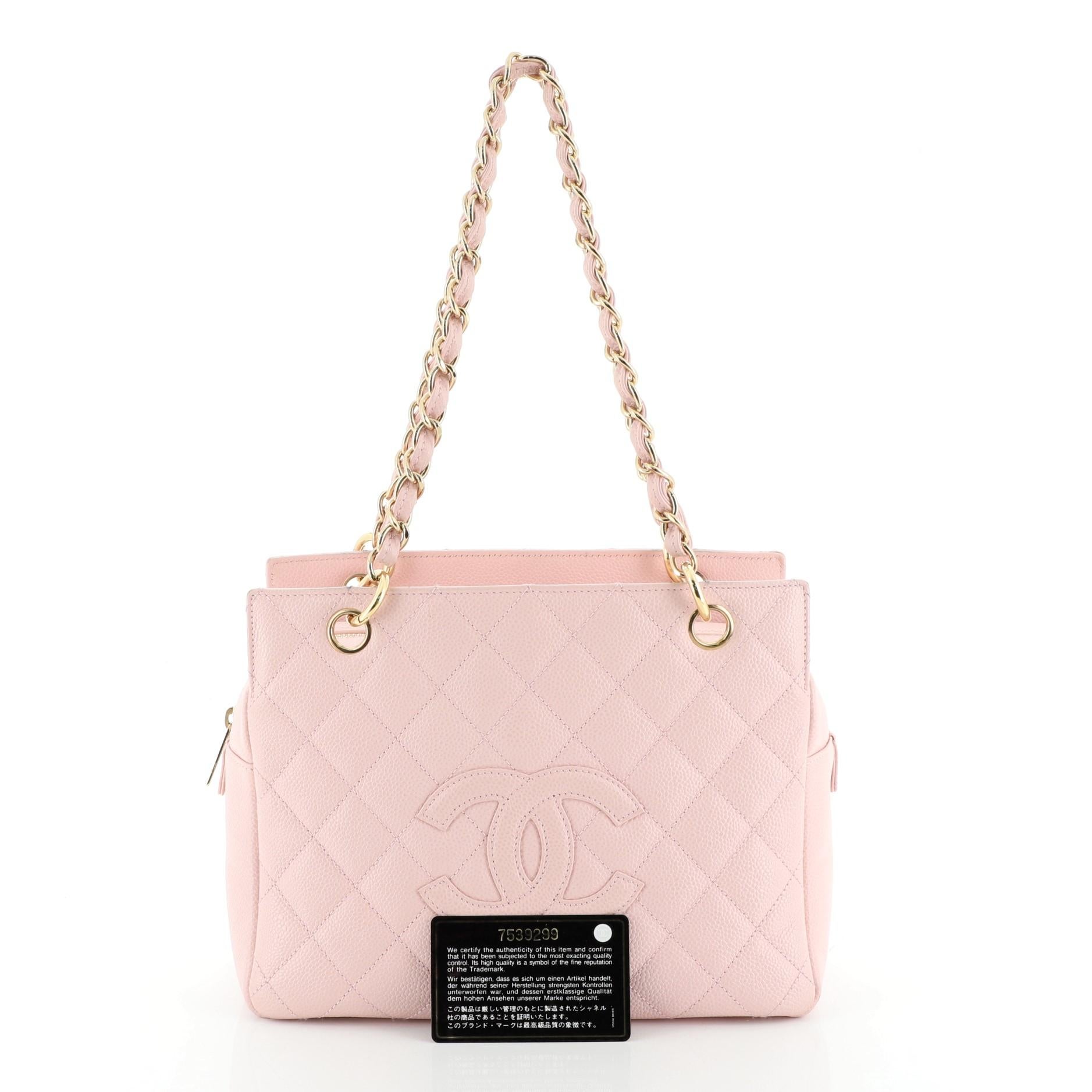 This Chanel Petite Timeless Tote Quilted Caviar, crafted in pink quilted caviar leather, features dual woven-in leather chain link straps, interlocking CC logo, and gold-tone hardware. Its zip closure opens to a pink leather interior with side zip